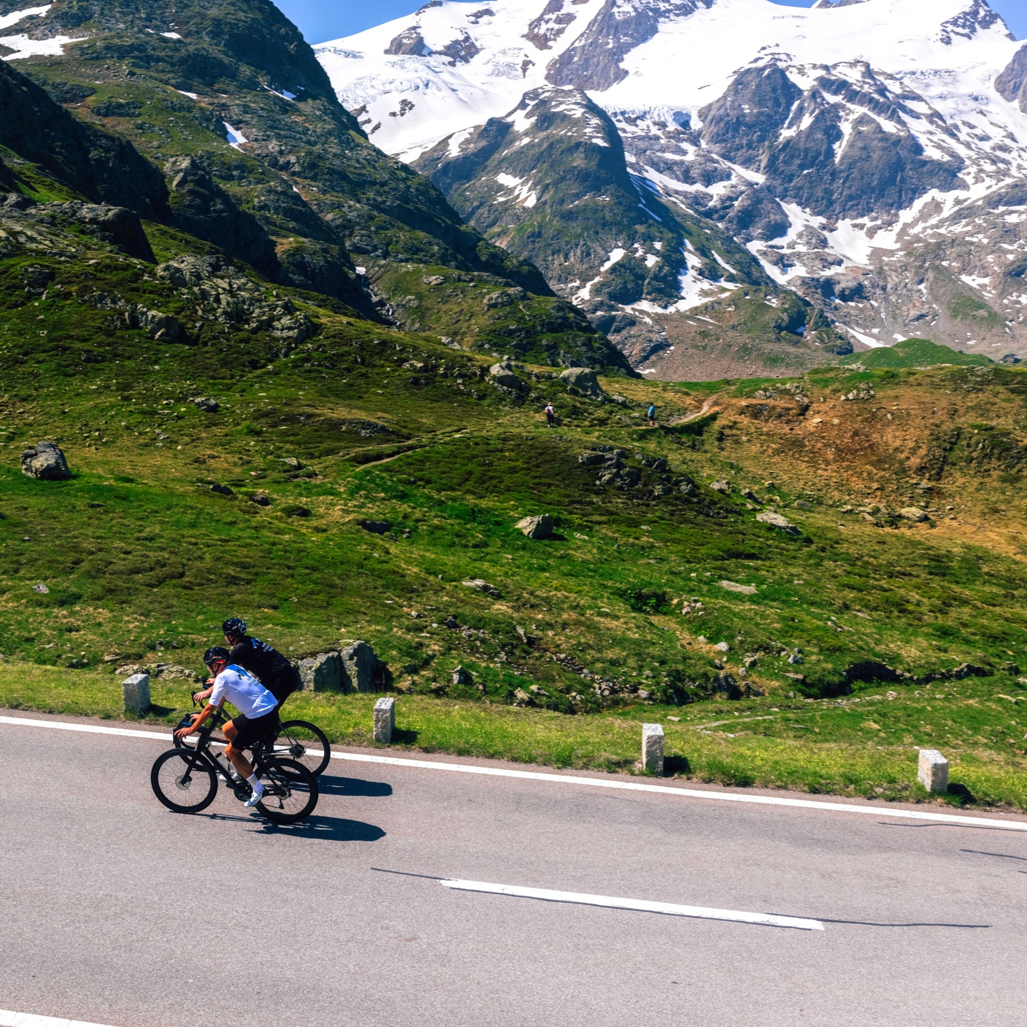 Cylists climbing the Grimsel Pass in the Swiss Alps