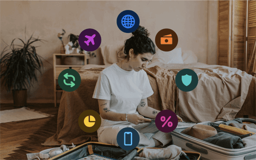 A person working at a table with art supplies, surrounded by colorful icons representing different concepts.