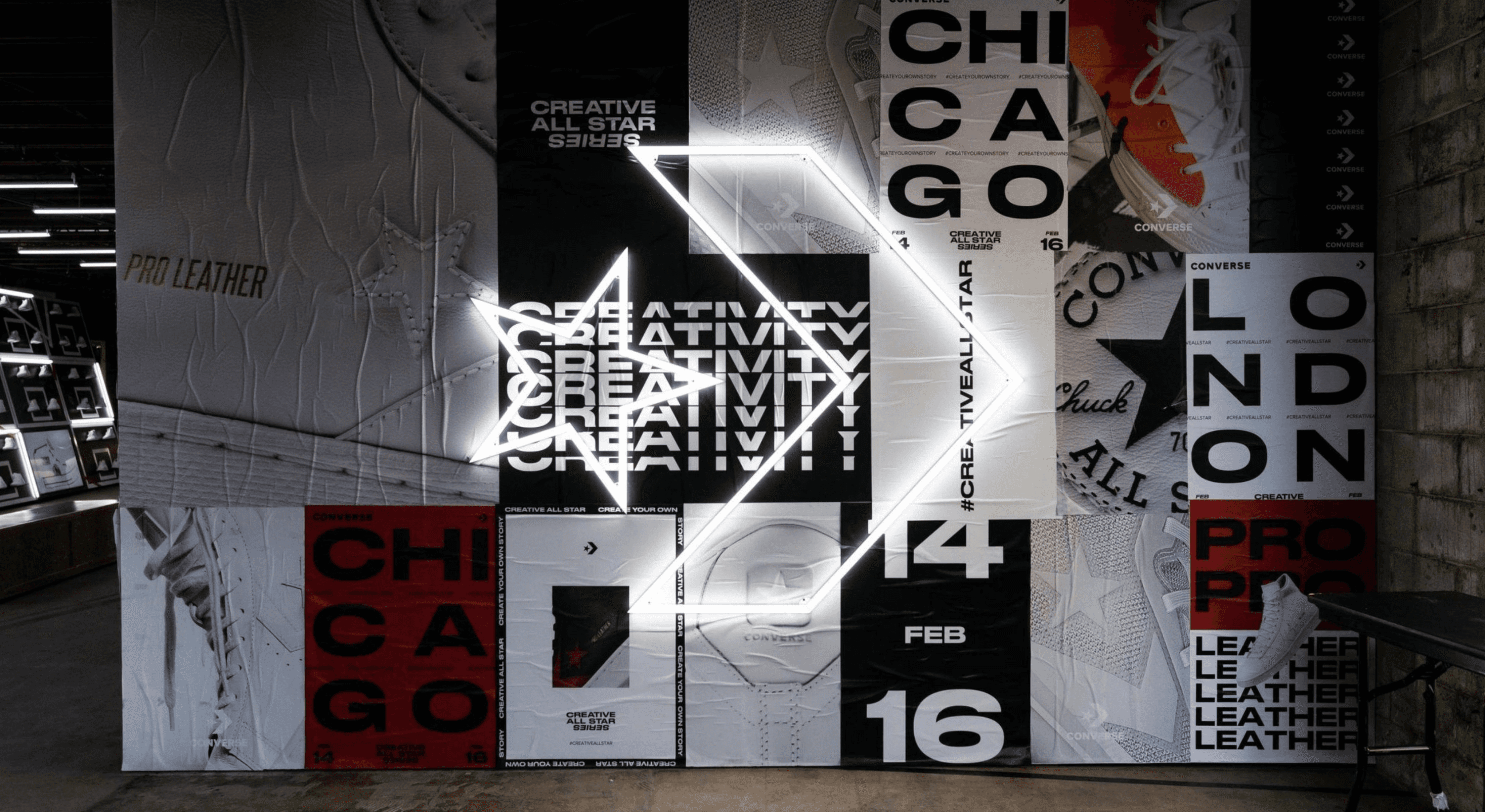 Illuminated converse symbol with collage background