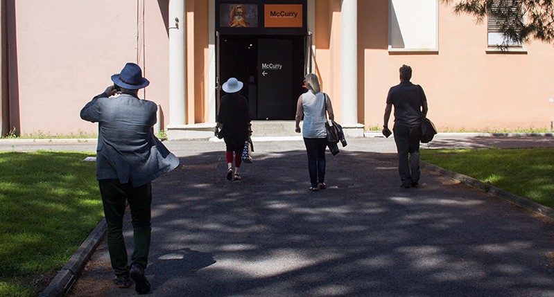 Group of people walking towards McCurry building