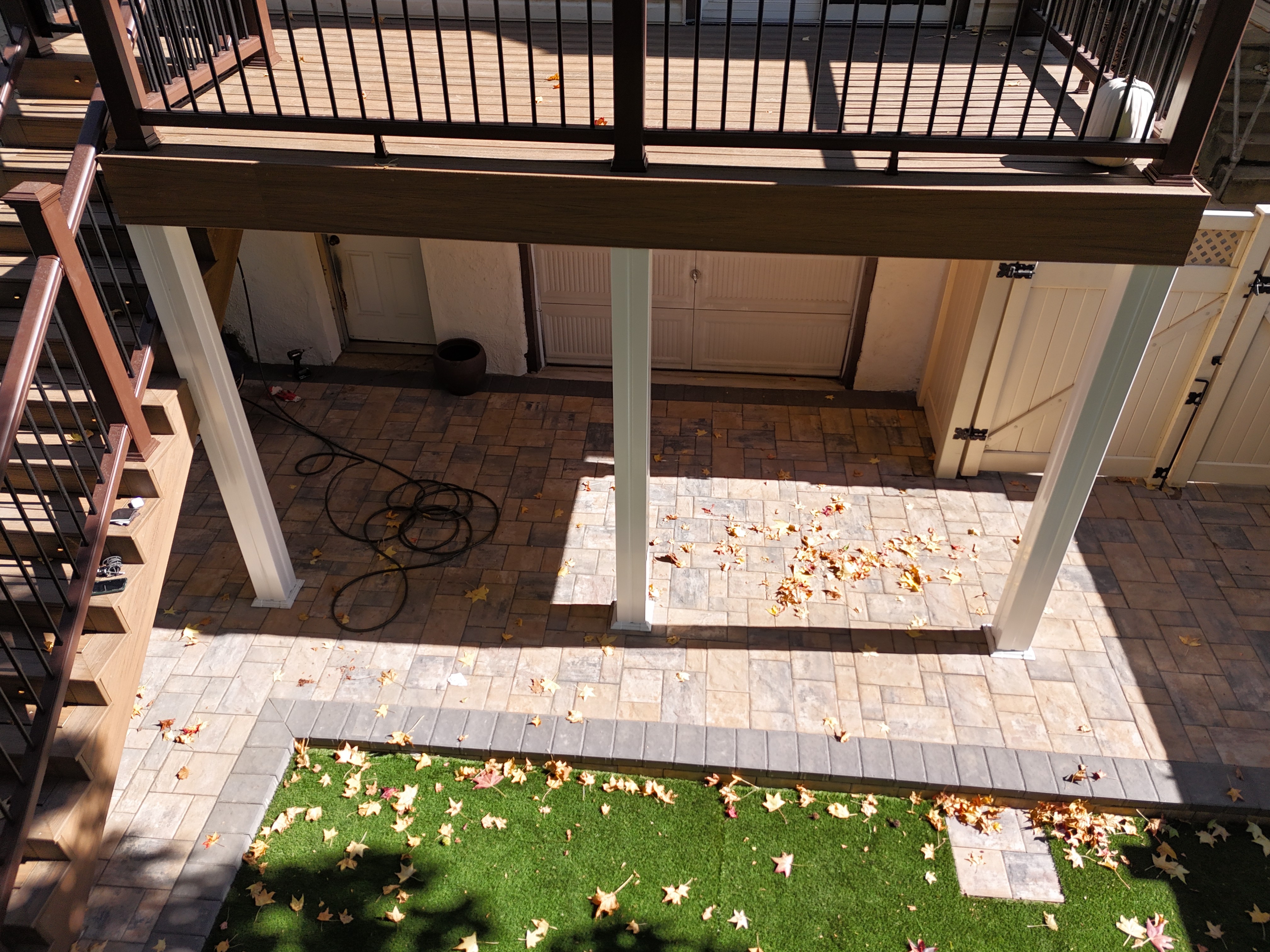 Luxury Trex composite deck stairs with picture framing, recessed lighting, and Transcend railings in Queens, NYC