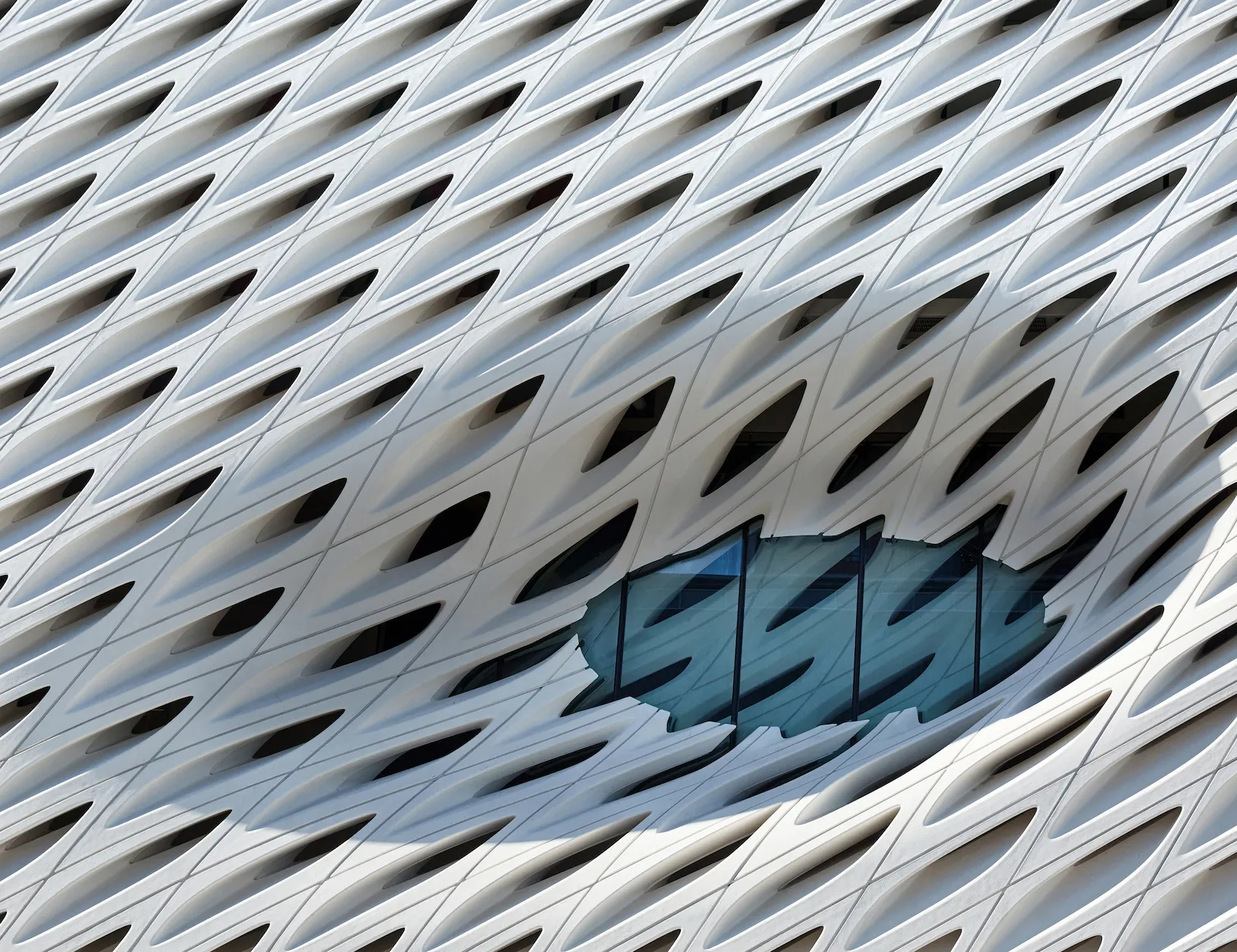 Veil facade occulus with glazed interior