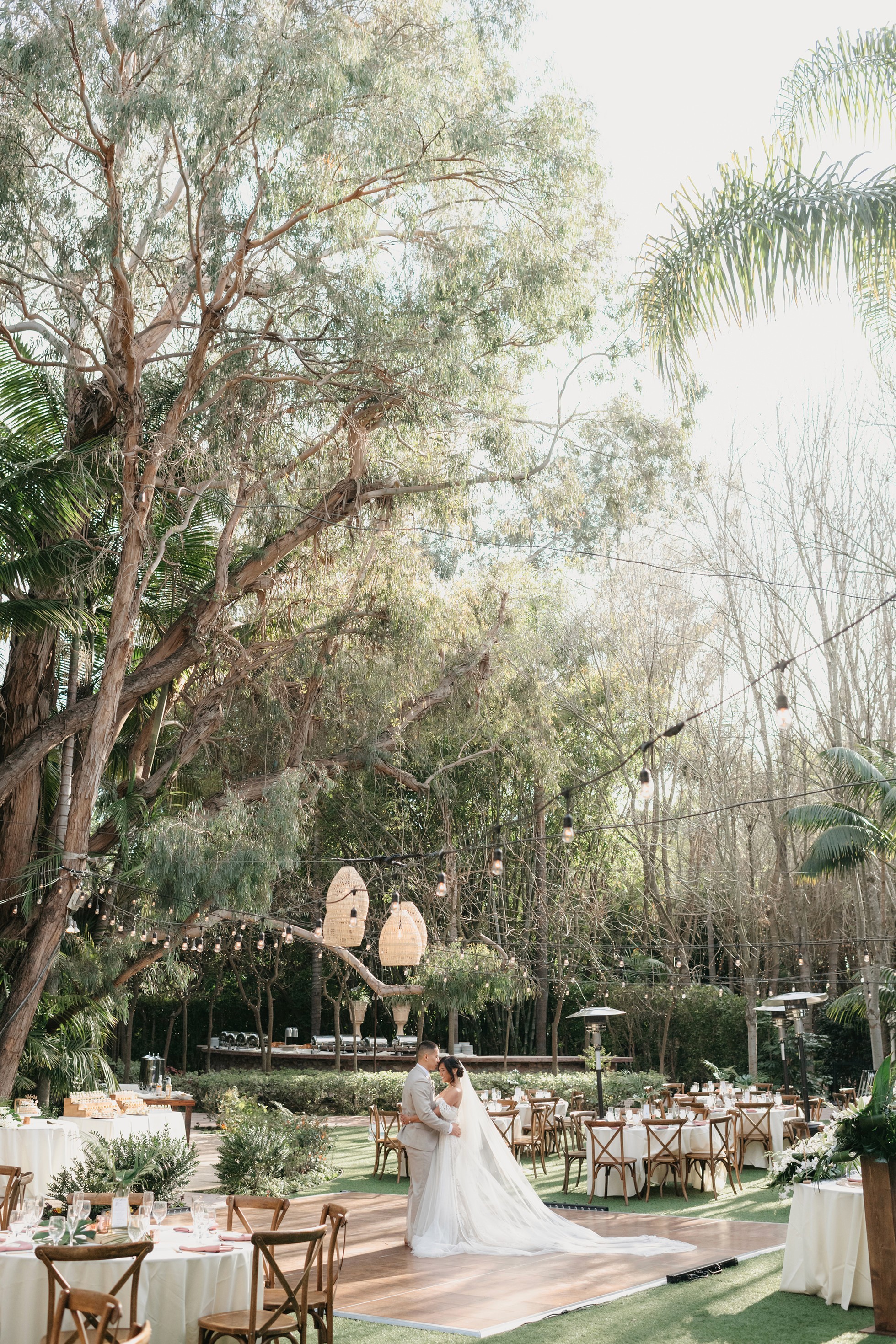 Outdoor wedding reception tablescape under the trees