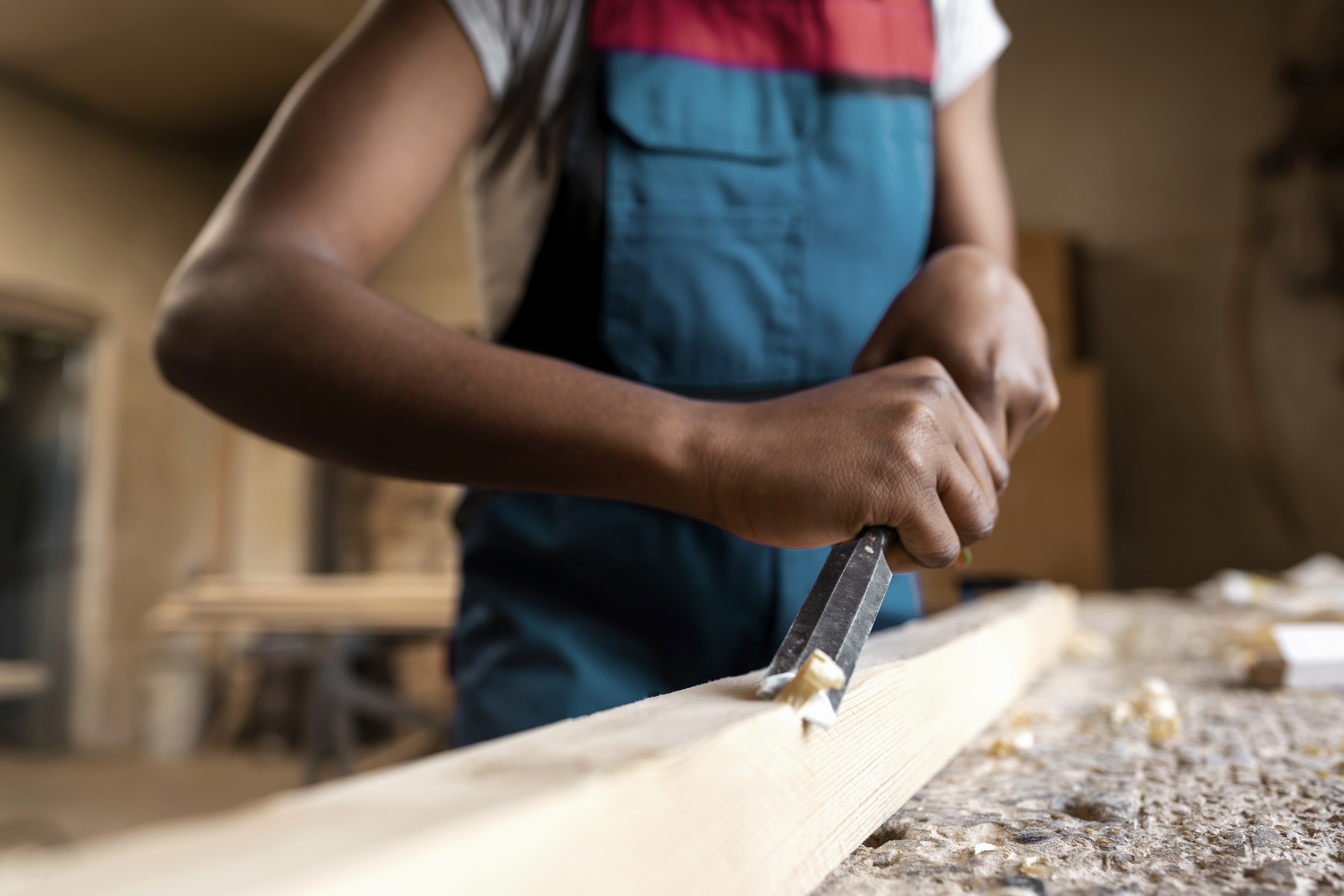 four orange, green, blue, and red paint rollers