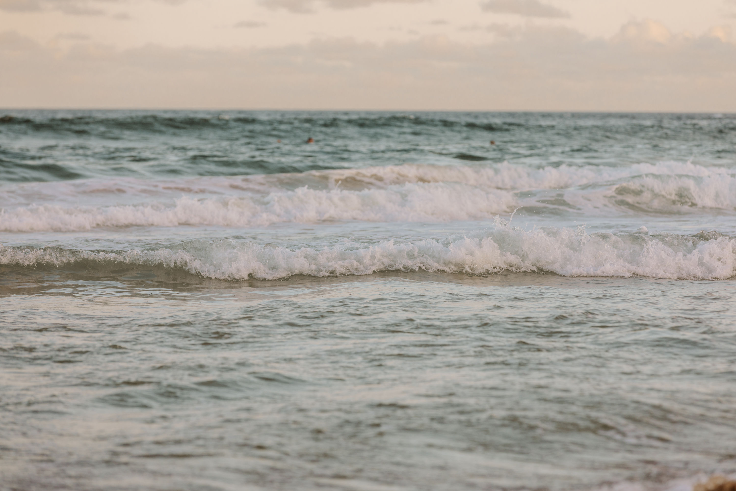 Happy couple embracing and smiling on a street.