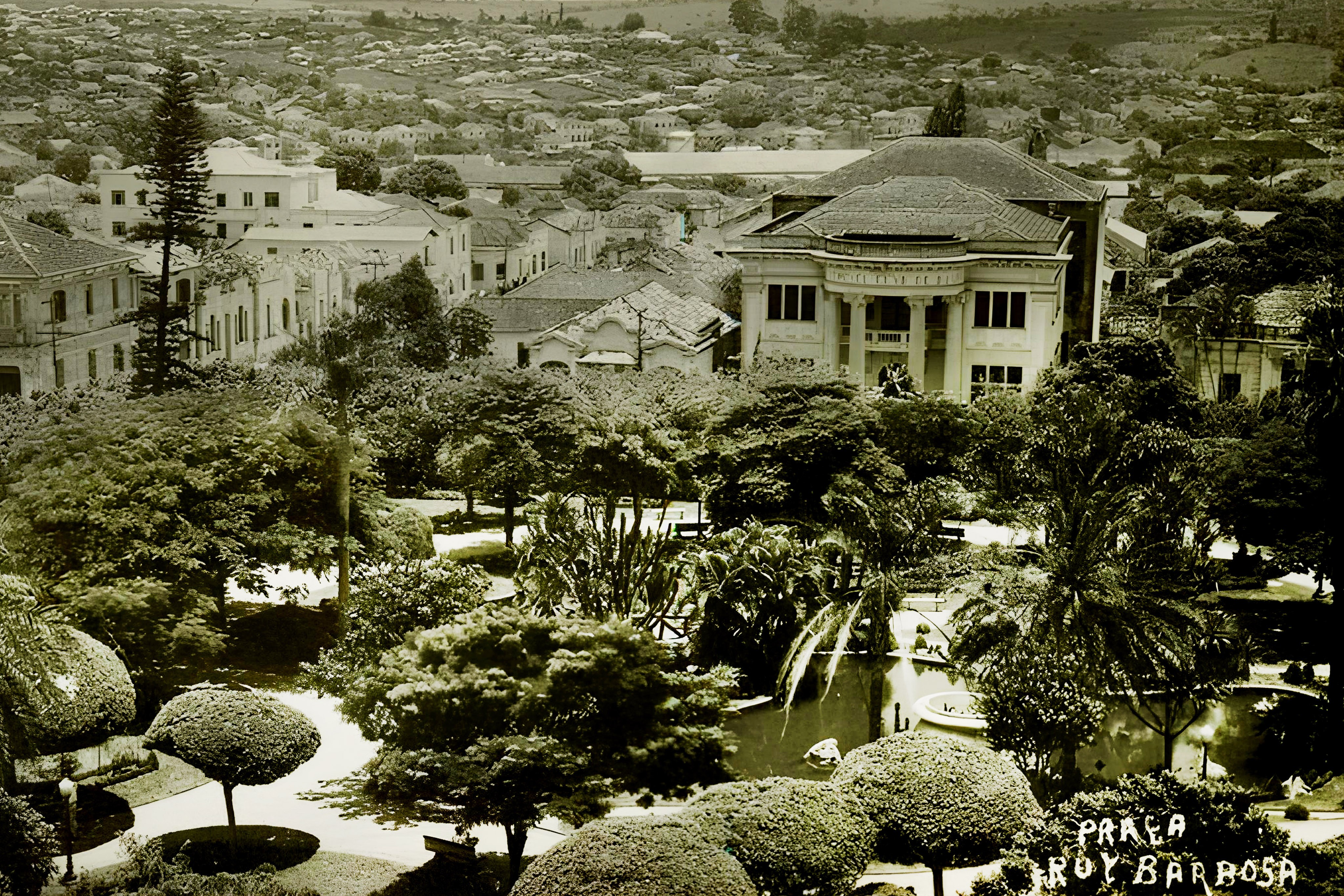 a black and white living room with a large tv