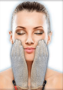 Close-up of a woman holding a dropper with skincare serum, preparing to apply it to her hand