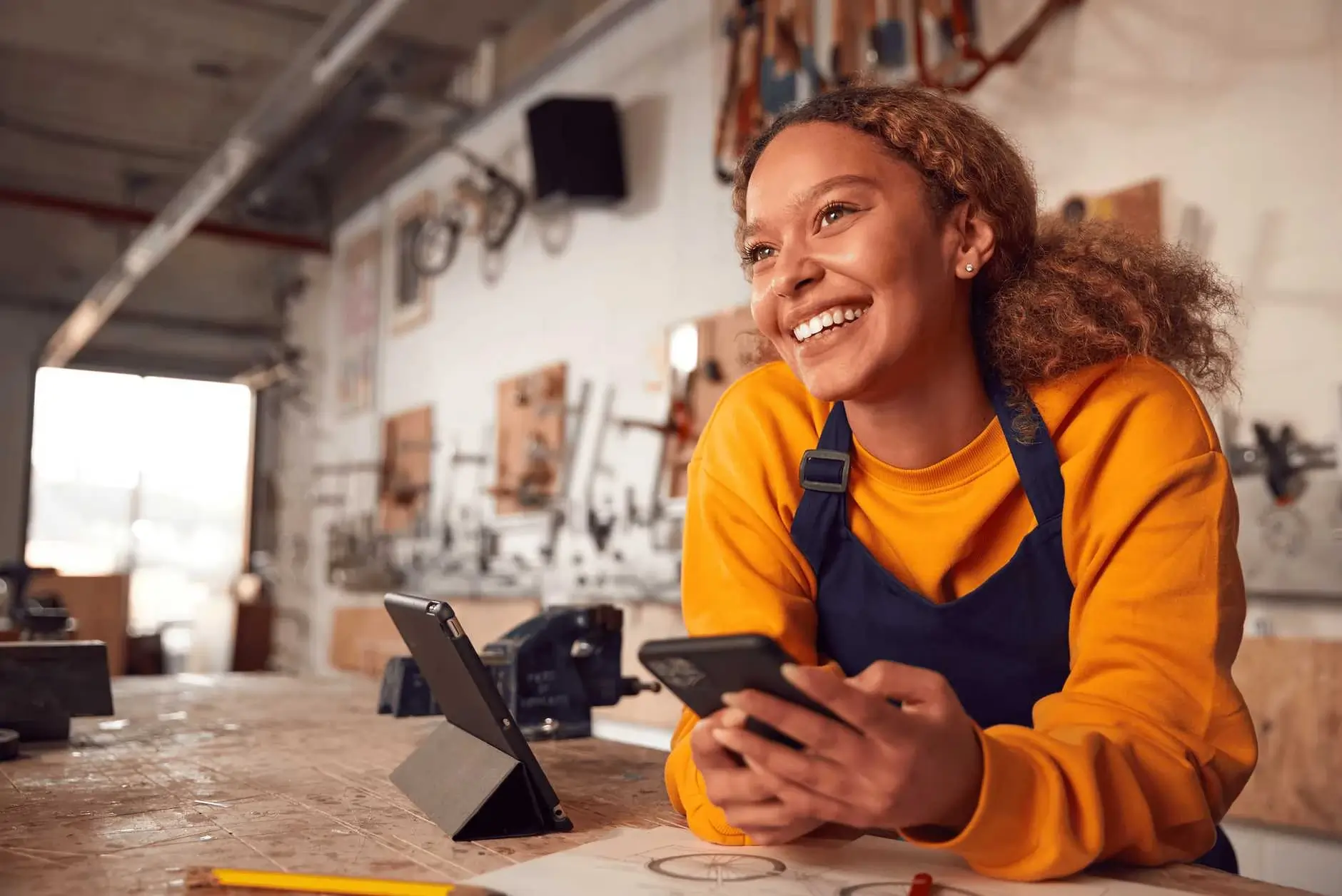 woman in workshop implements small business invoicing tips to improve her business's cash flow