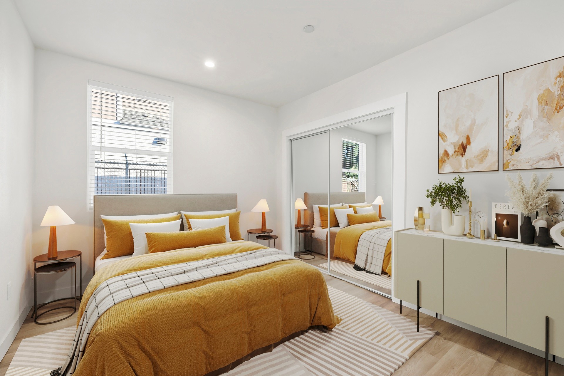 Primary bedroom with mirrored closet doors, modern finishes, and staged furnishings at 1038 E 53rd