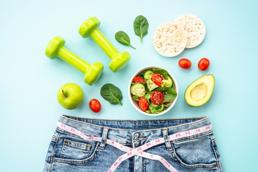 flat lay of pants and health foods