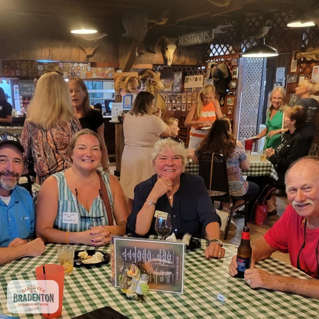 4 people at table in bar bradenton