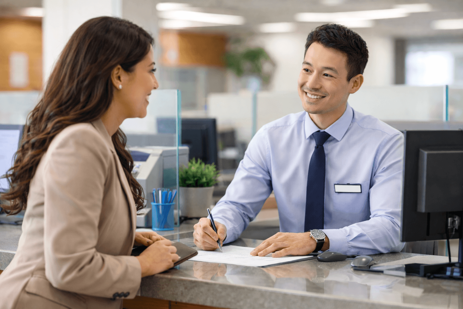 woman chats with bank teller
