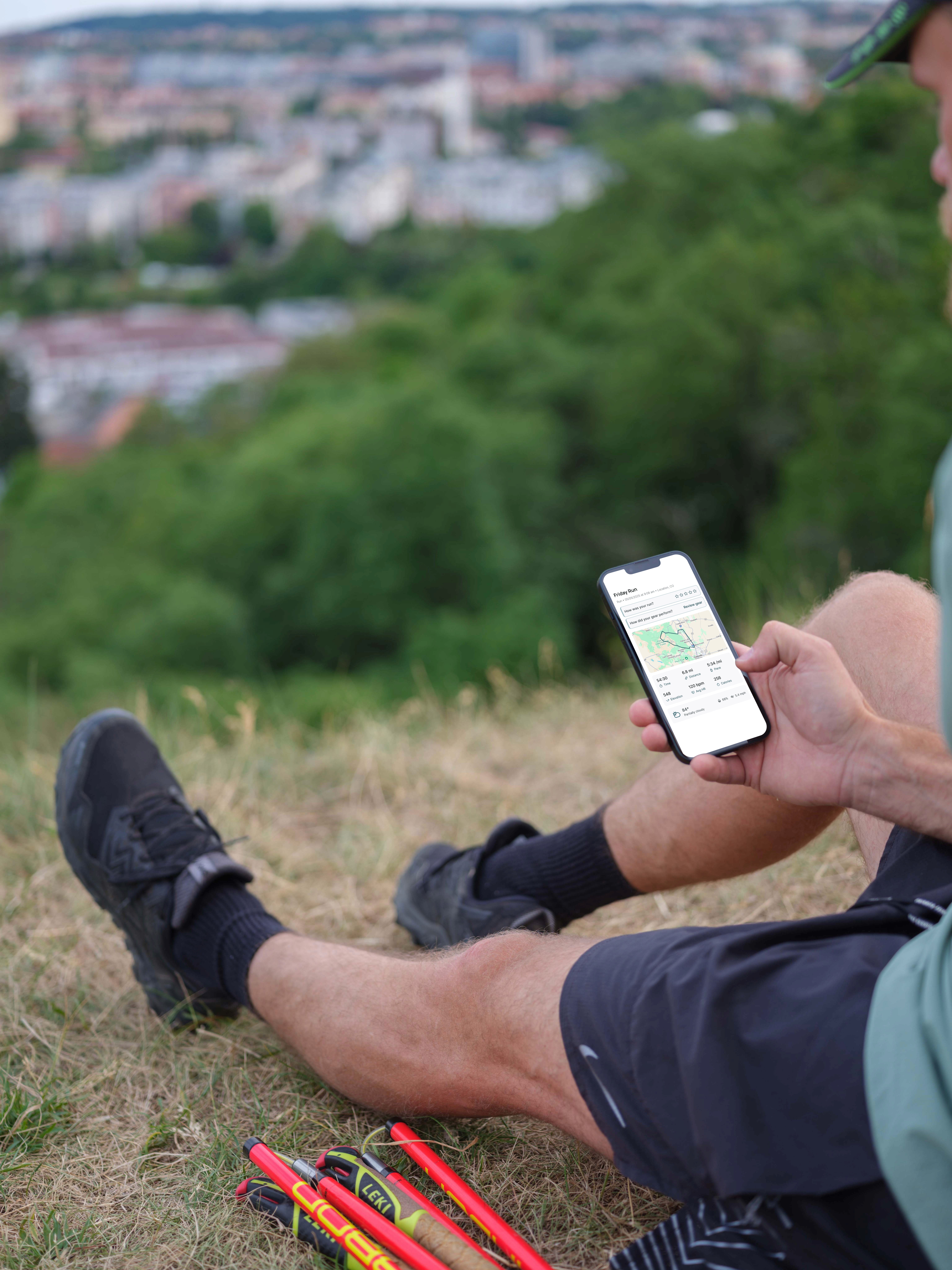 a man running down a trail in the mountains