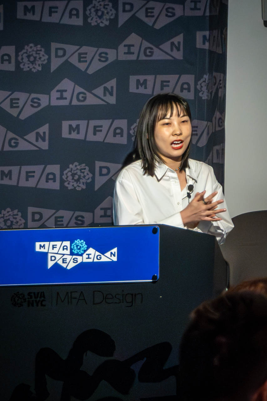 Woman at a podium delivering a presentation