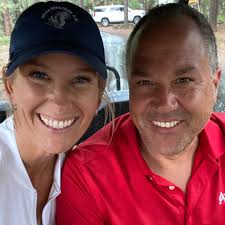 Lady smilinh with husbamd 