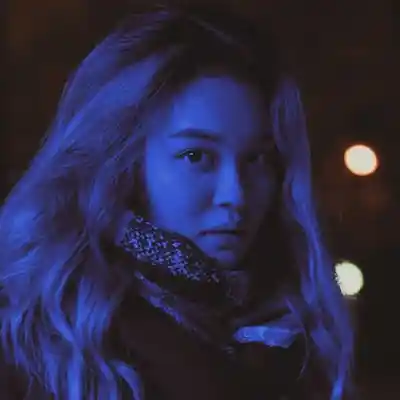 a Girl showing his face in night