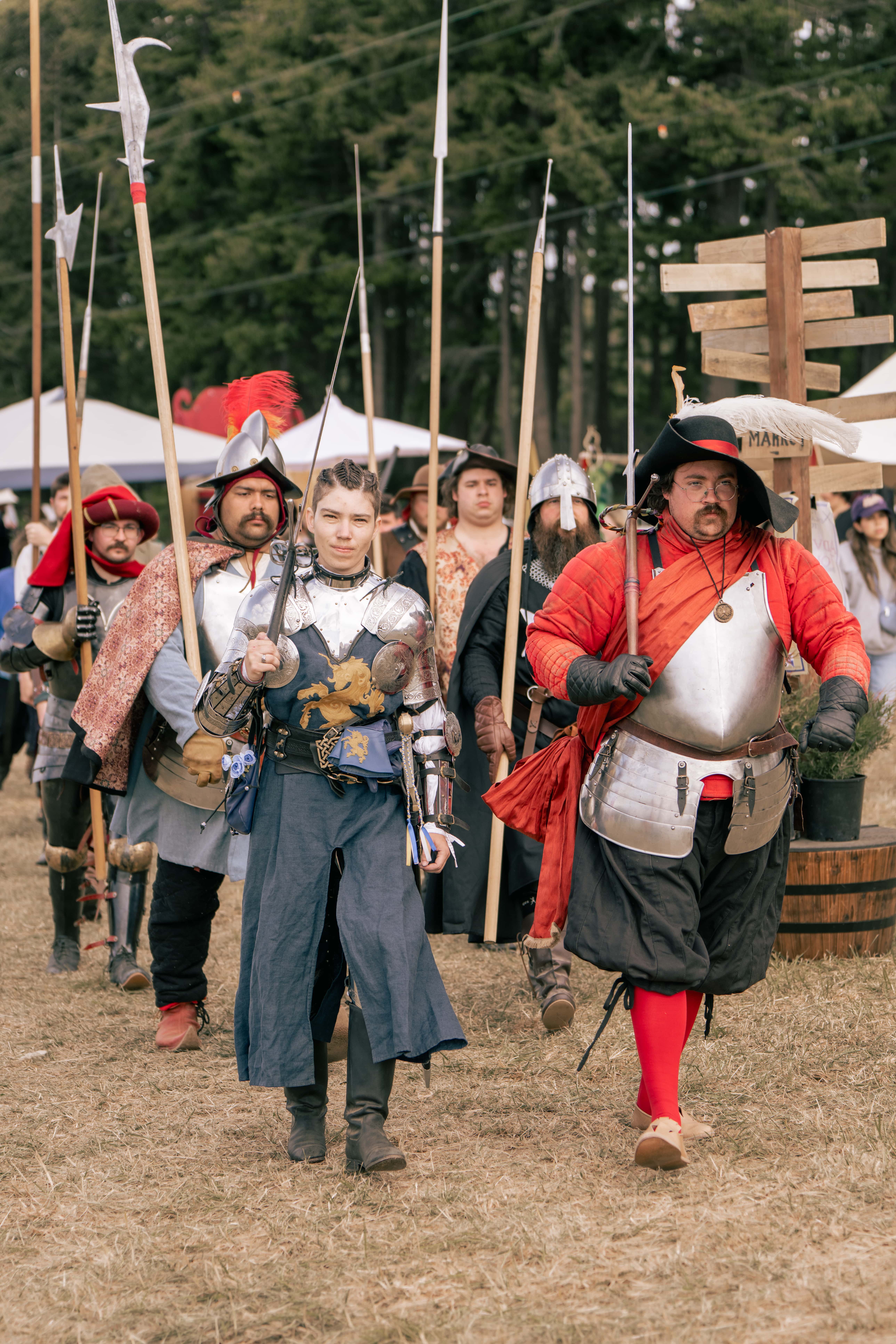 Group of WRF guests marching with spears