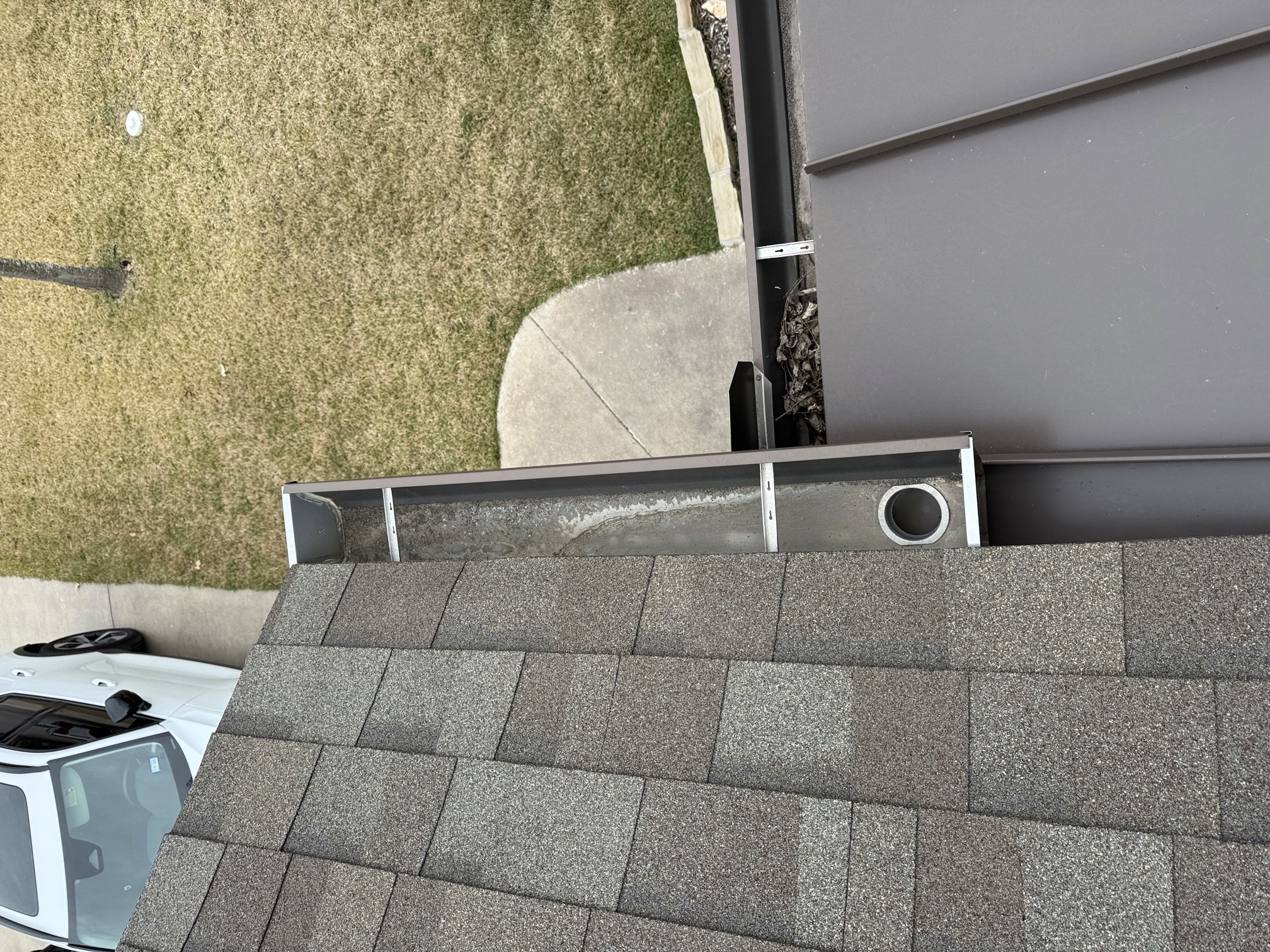 Roof-edge and gutter detail from the Boerne cleaning and leaf-guard project.
