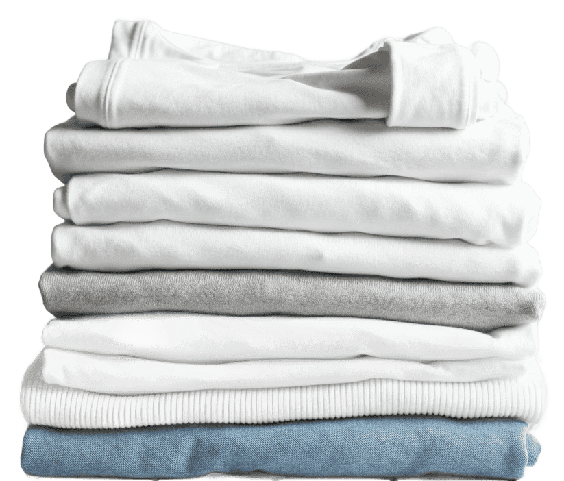 folded clean white laundry stacked up on a white oak table