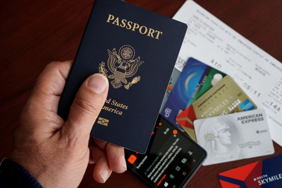 US passport with travel cards and financial documents