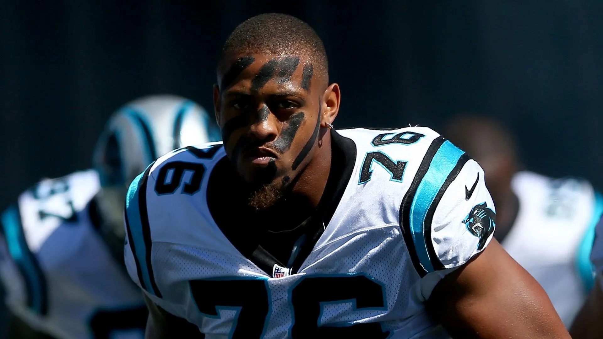 why football players wear eye black, why do football players paint their faces, eye black football meaning, does eye black work in football, face paint football reasons, football eye black purpose, why NFL players wear eye black, college football face paint meaning, football face paint intimidation, football face paint tradition, psychological effects of face paint football, eye black vs face paint football, NFL face paint rules, football players black stripes under eyes, does eye black reduce glare, football game face paint psychology, why defensive players wear face paint, football pregame rituals face paint, eye black glare reduction football, football war paint meaning