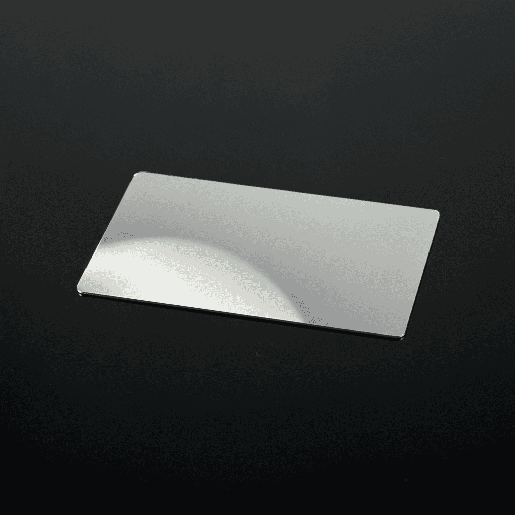 A toothbrush with a soft bristle head positioned against a black background.