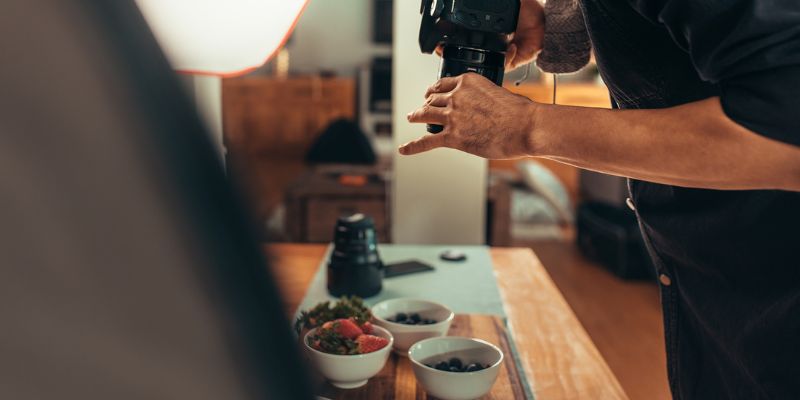 A man taking a photo of food