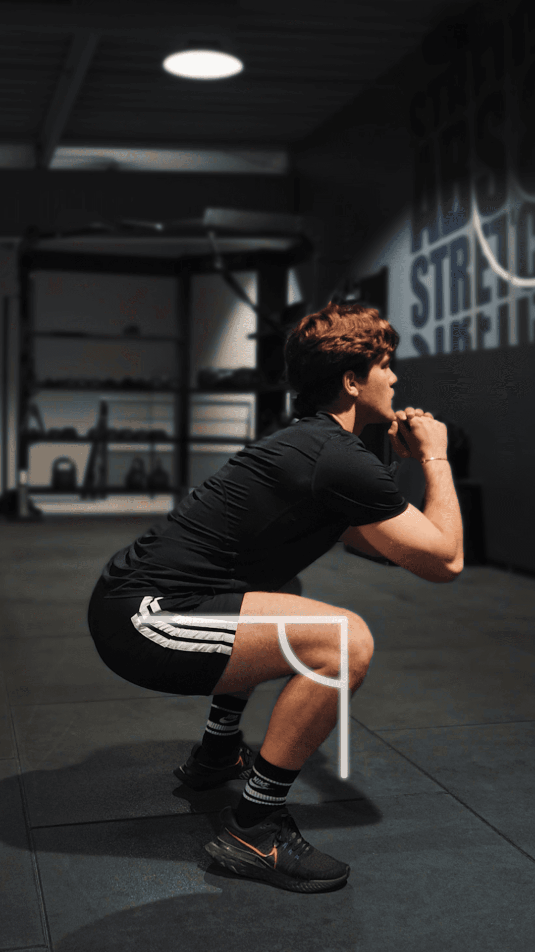 A person reviewing fitness activity on a mobile device inside a modern gym space, reflecting workout tracking, progress insights, and clear activity results.