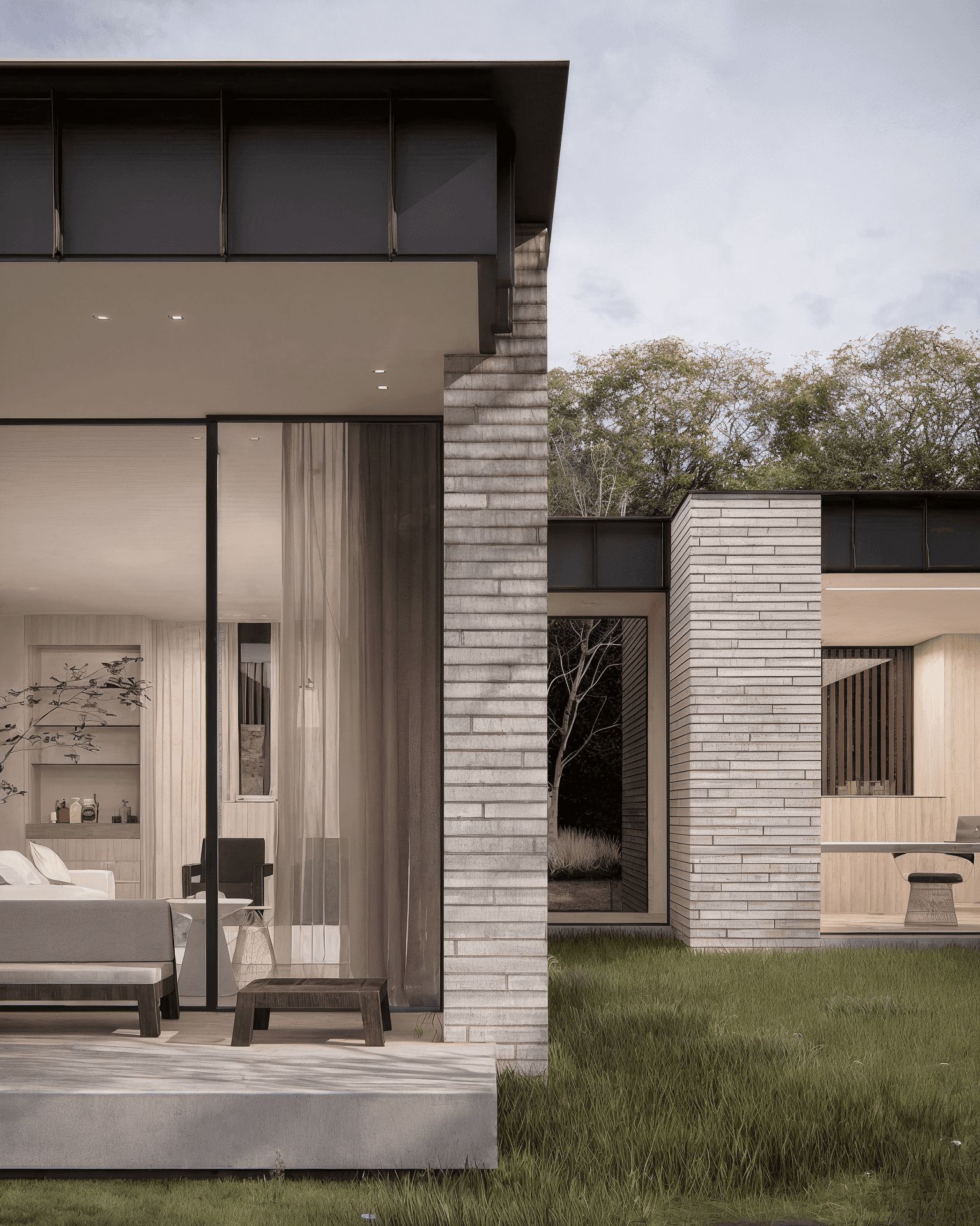 Detail van achtergevel moderne villa Grayhouse met baksteen en glas