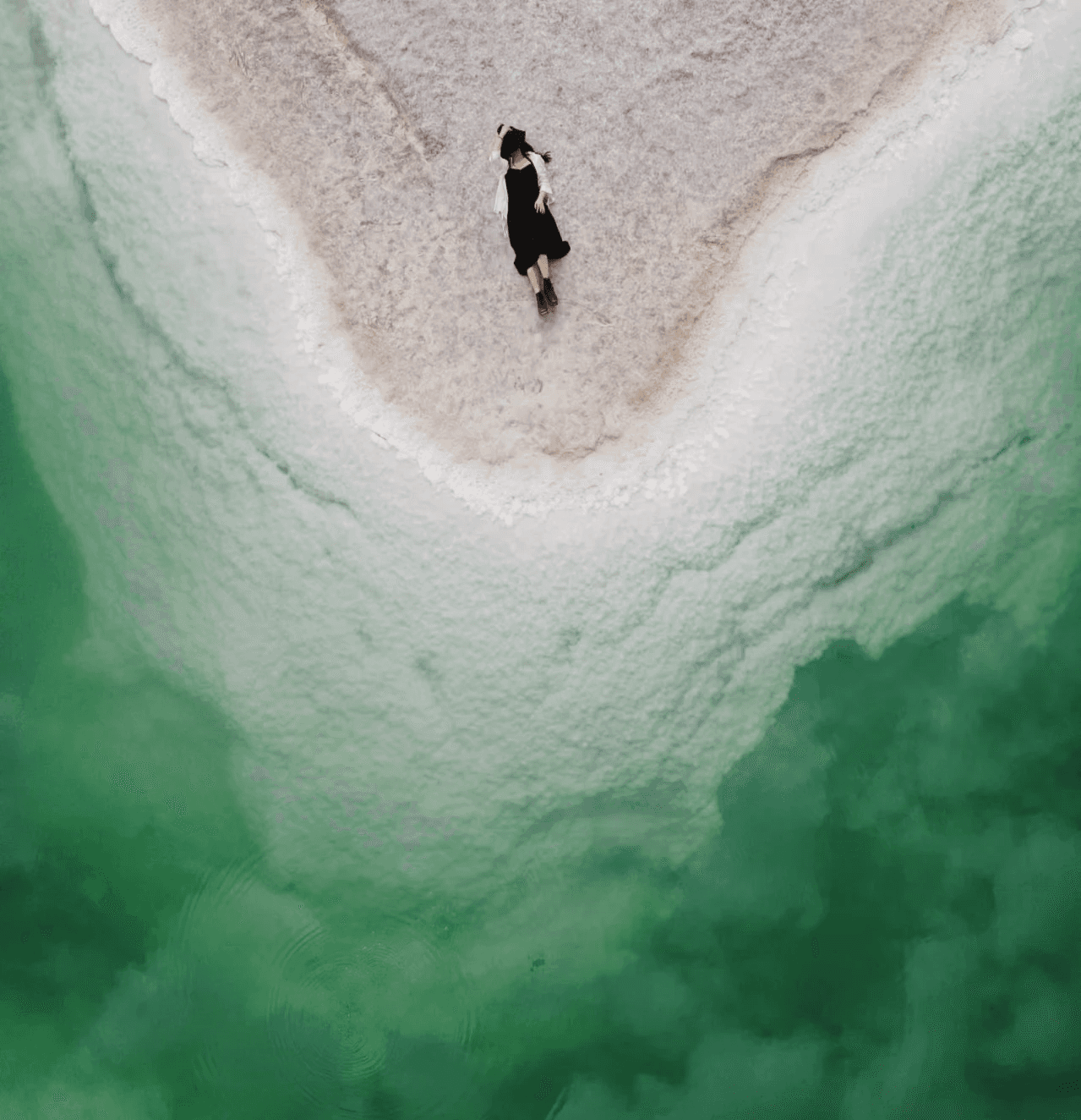 Extreme close-up of a Black person looking directly at the camera, face filling frame.