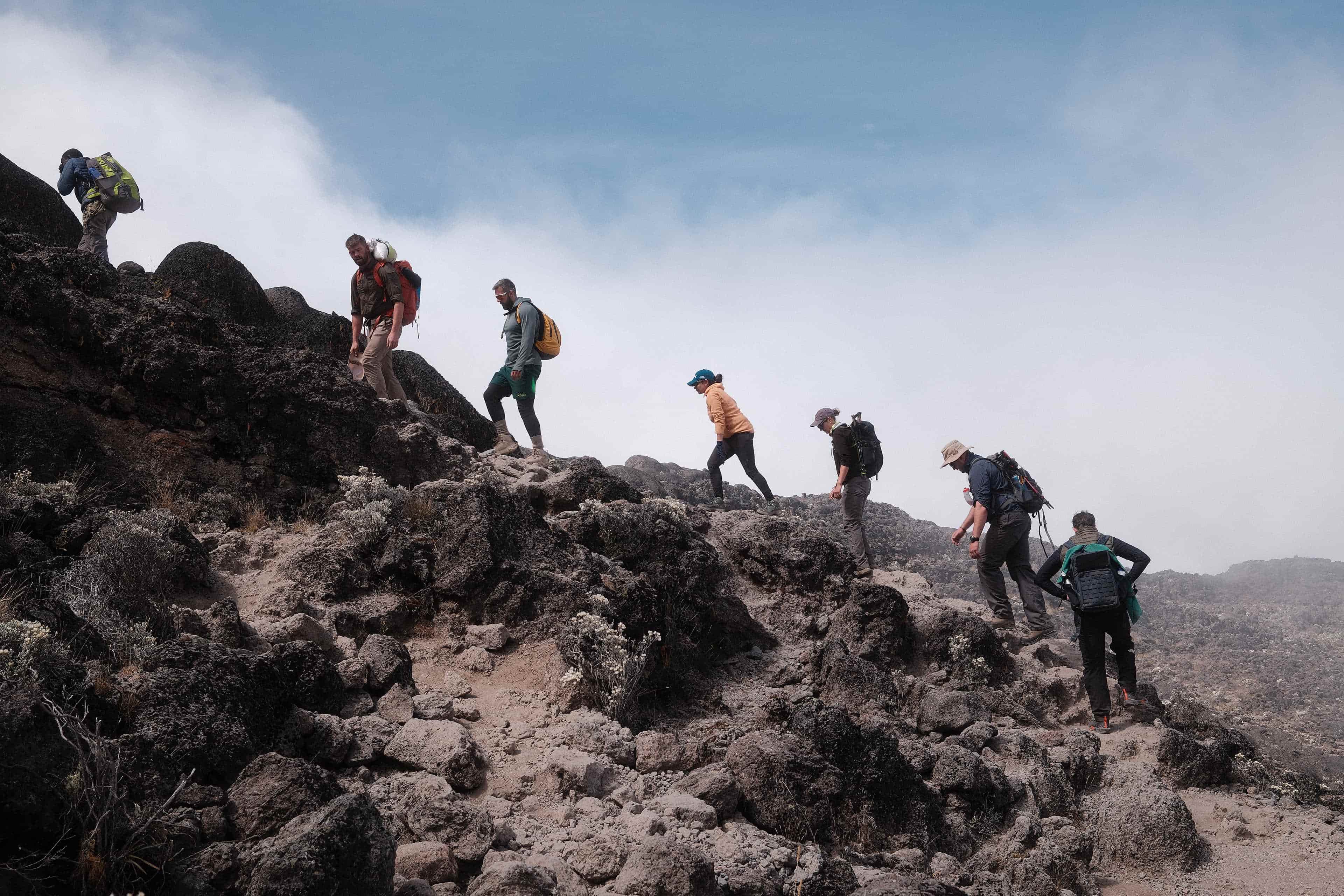 Climbers ascending a steep section of Kilimanjaro on the Lemosho Route.
