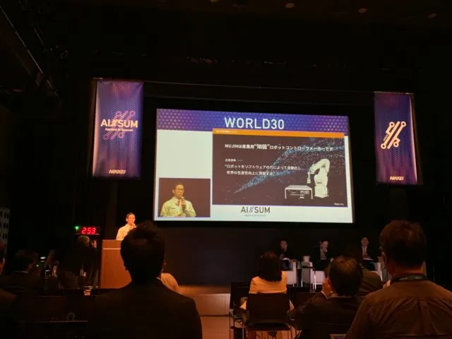 Picture of the AI/SUM World 30 presentation stage