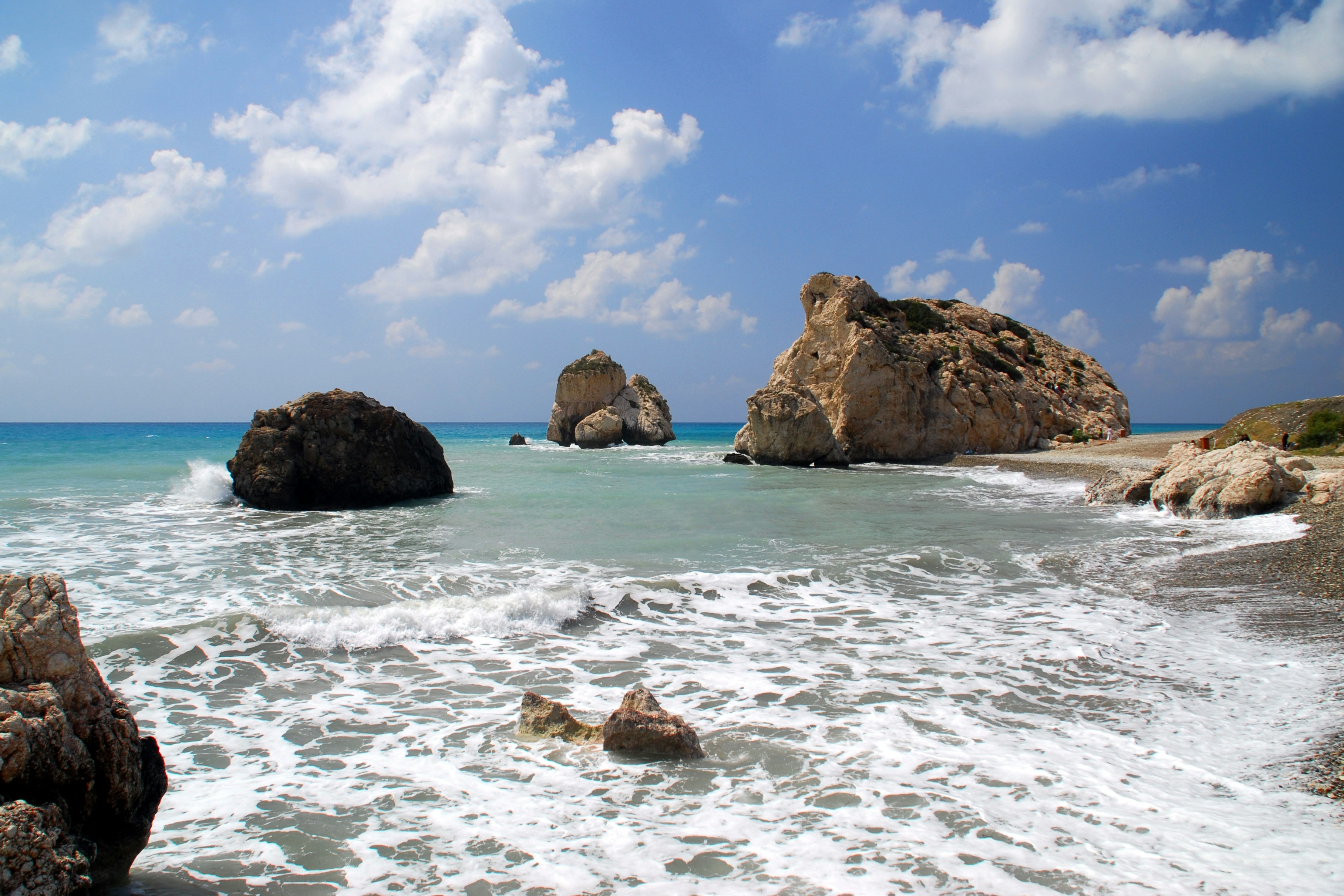 brown rock formation on sea shore during daytime