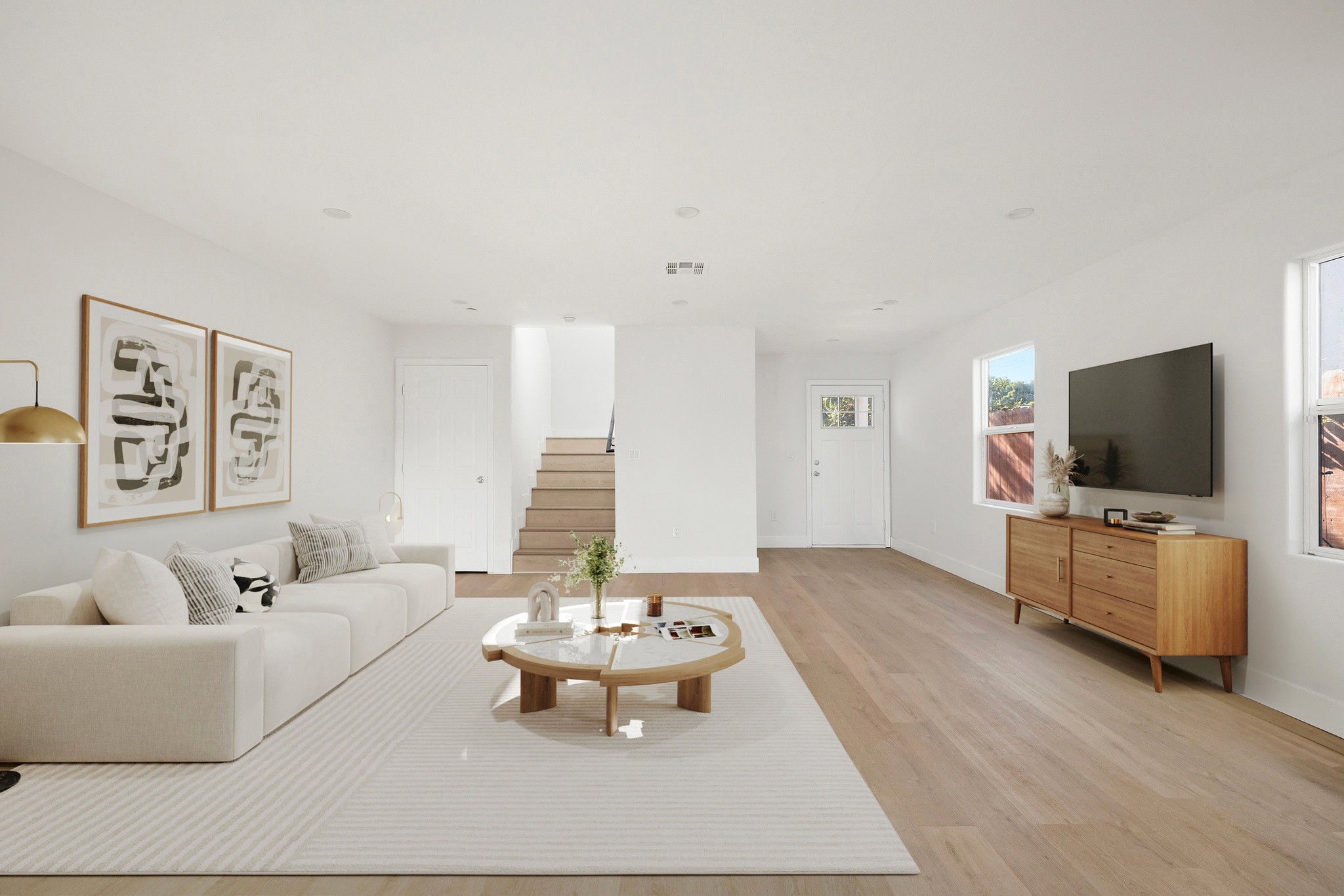 Spacious living area with natural light, recessed lighting, and contemporary staging at 645 west 97th street.