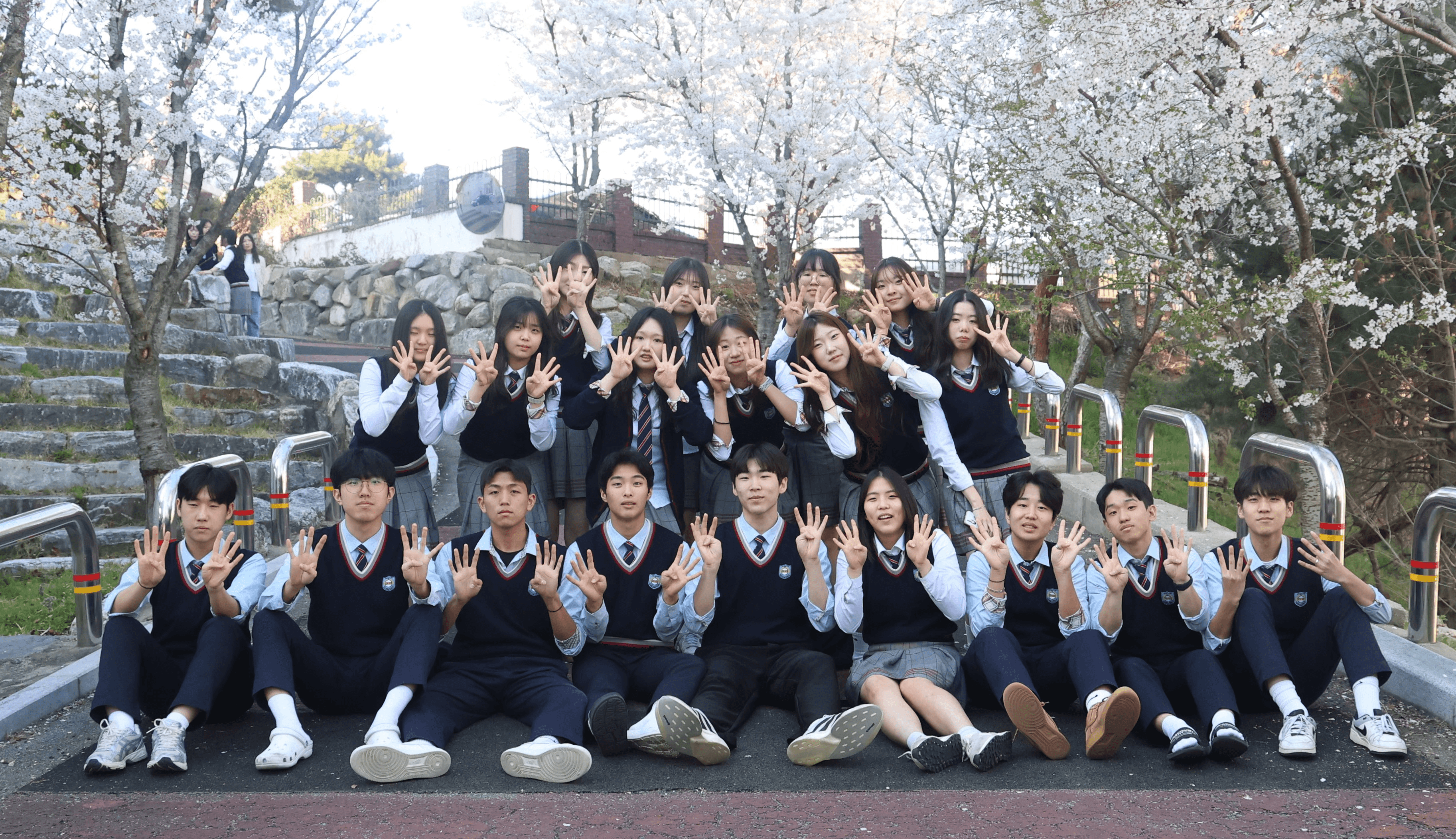 Palm trees reach towards a vibrant, blue sky.
