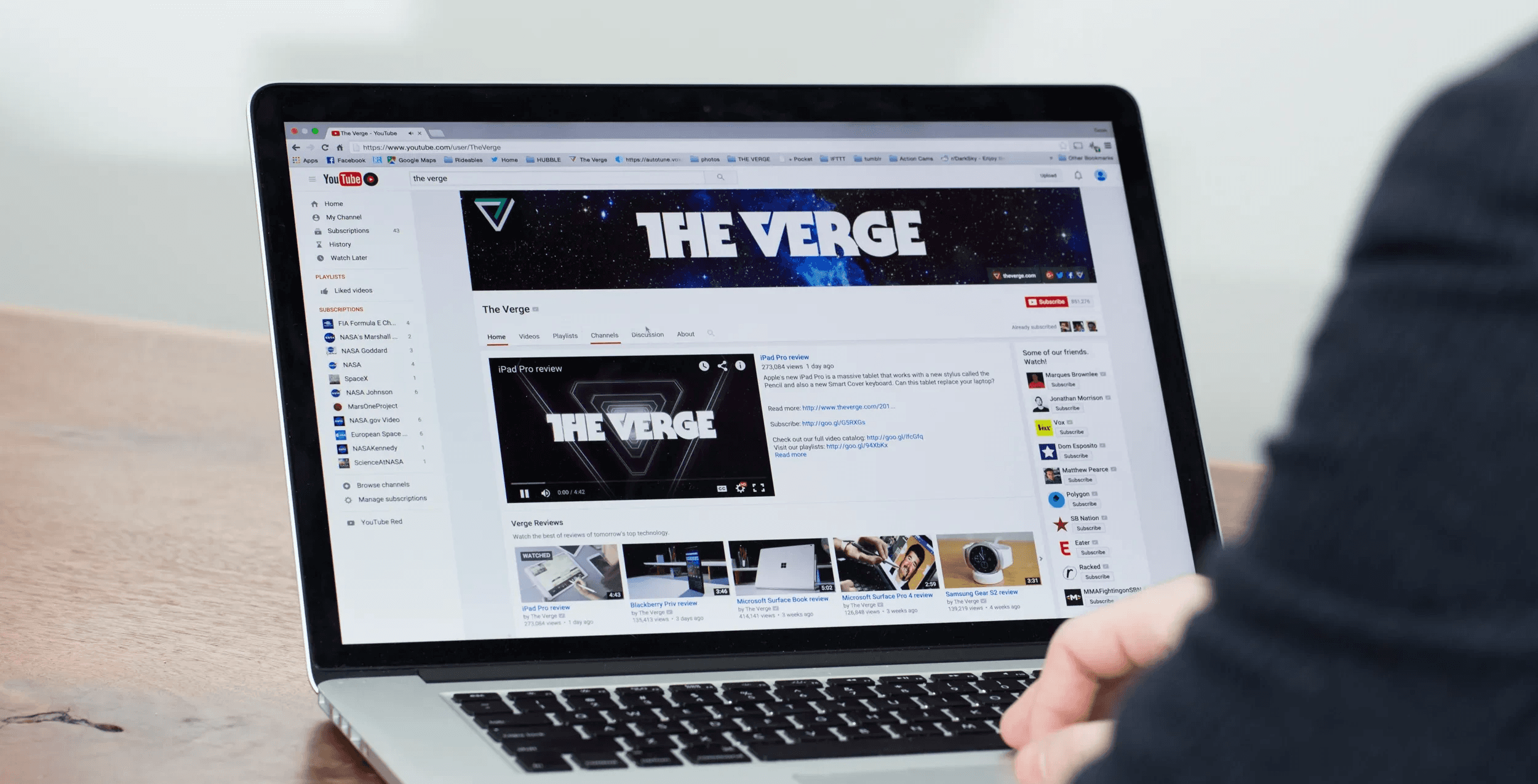 Person browsing YouTube channel on laptop - YouTube Average View Duration