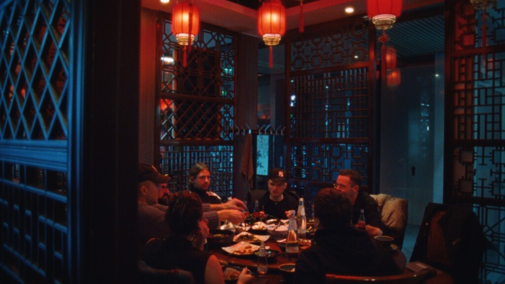 Souly and his friends inside a chinese restaurant.
