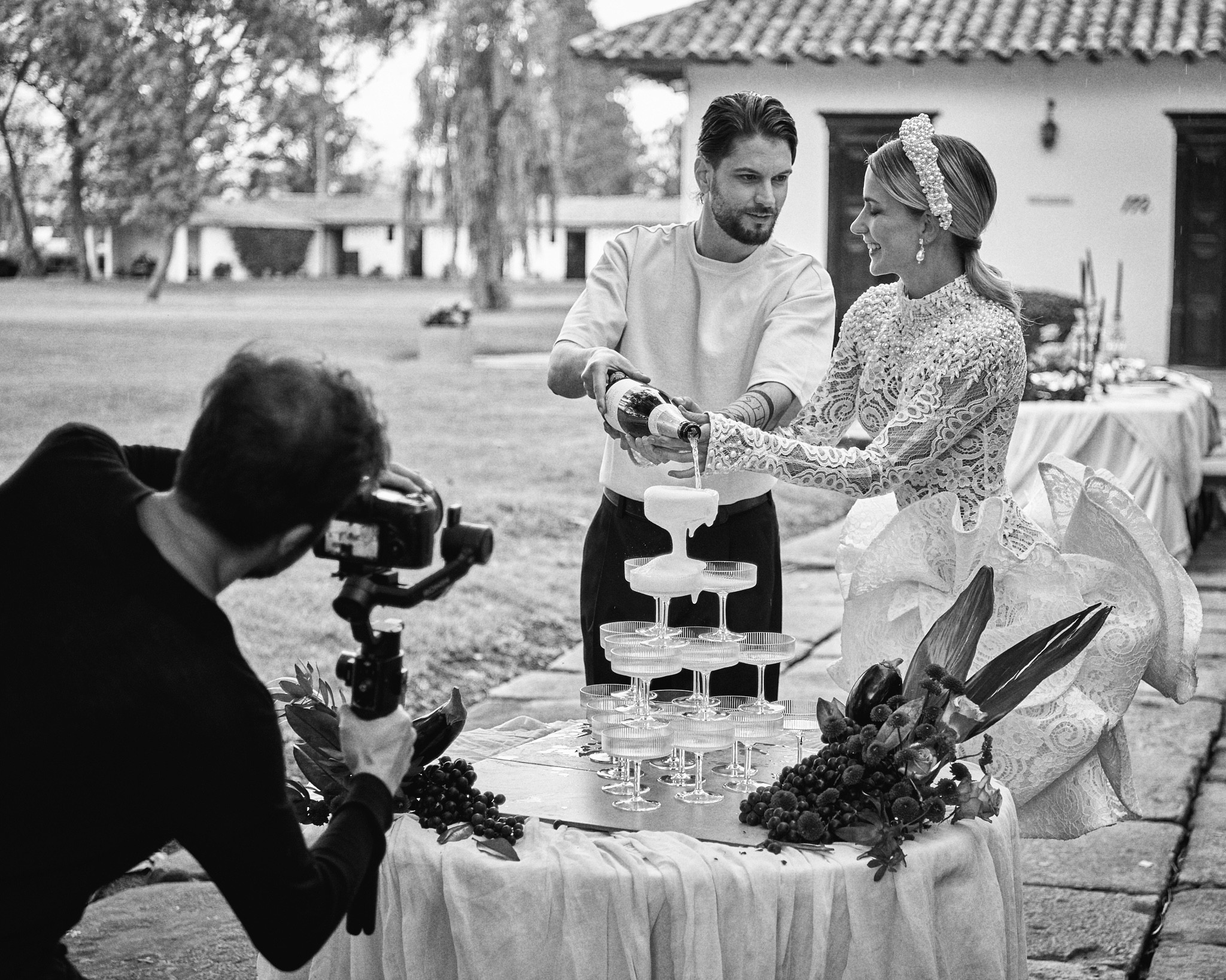A model surrounded by photographers holding cameras