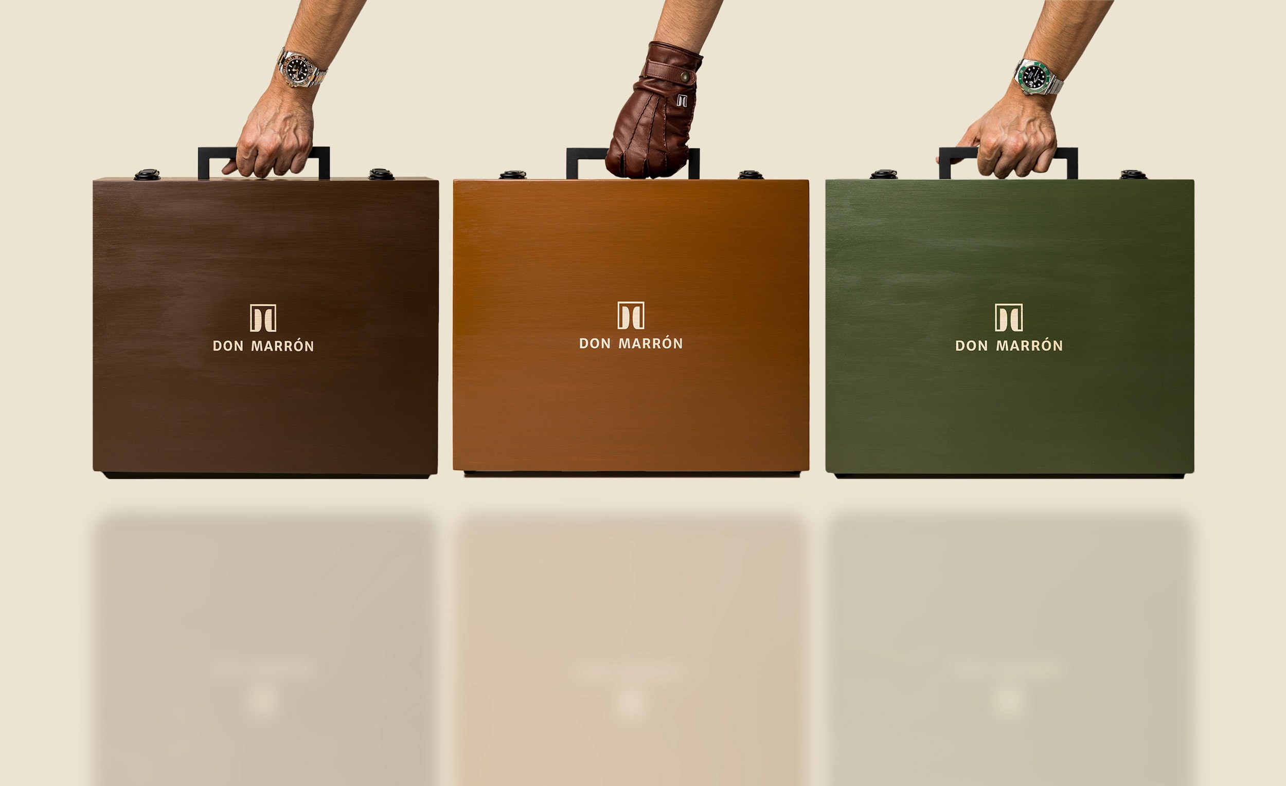 A refined display of Don Marrón’s handcrafted briefcases — available in rich brown, tan, and green hues, each designed for the modern gentleman with impeccable taste.