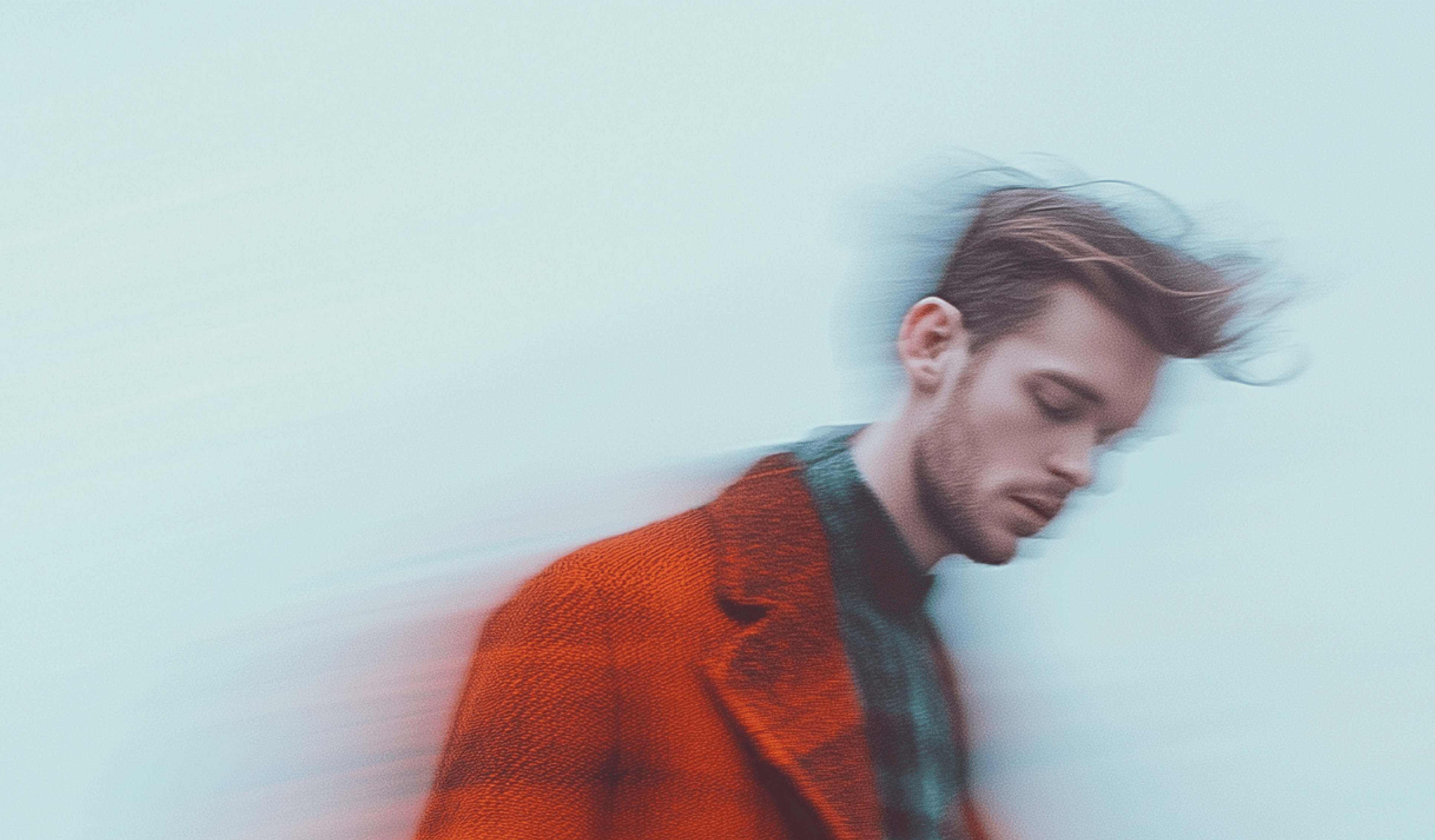 Conceptual image of a person in a coat, blurred motion.