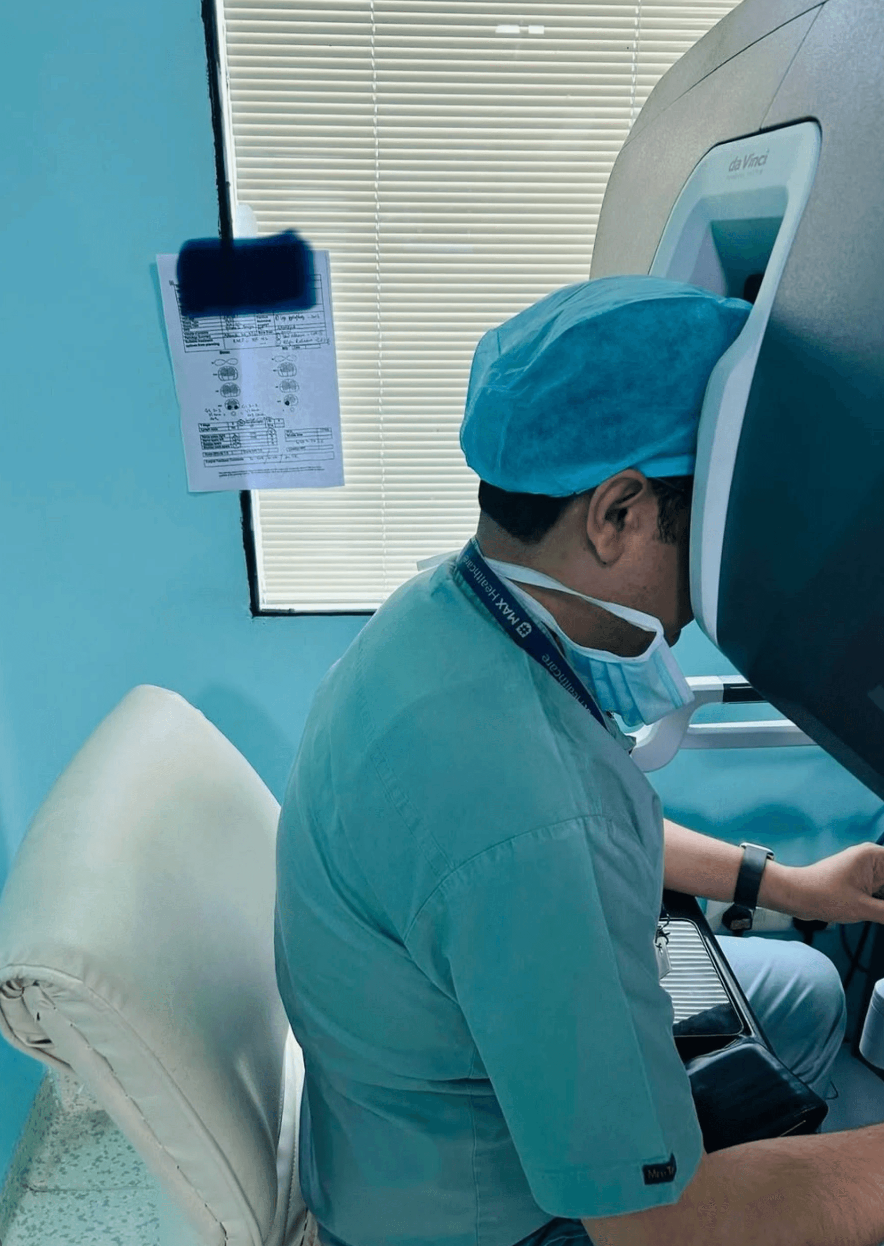 Dr Tushar sitting at Surgeon Console and controlling the robotic instrument Da Vinci Xi.