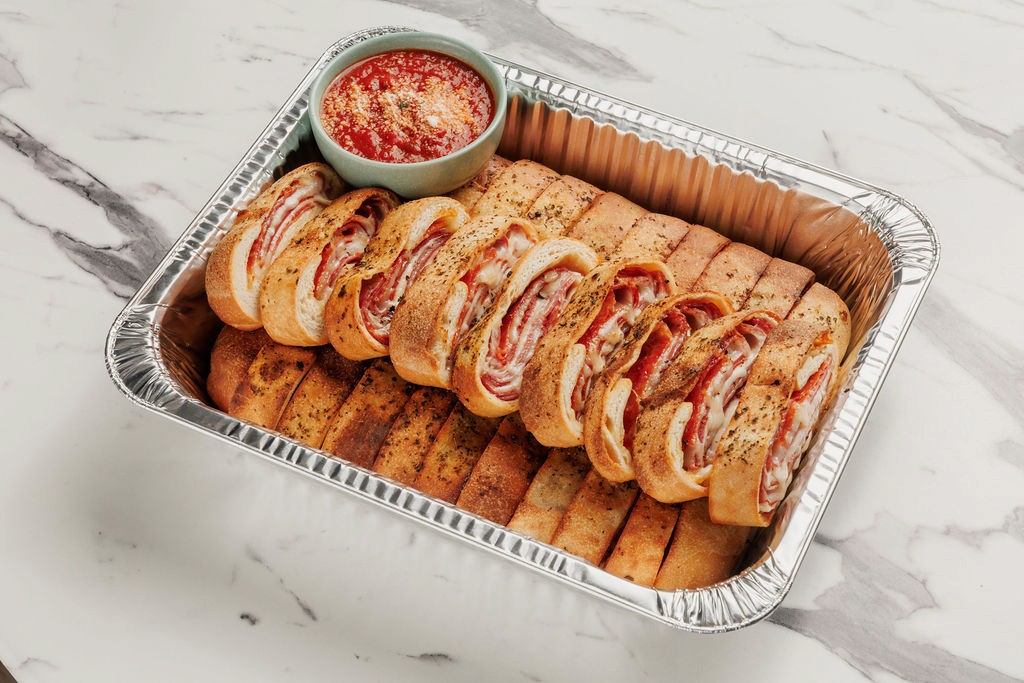 breadsticks, meatballs and salad from degidios catering