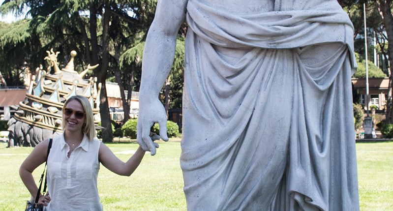 Female posing with the sculpture