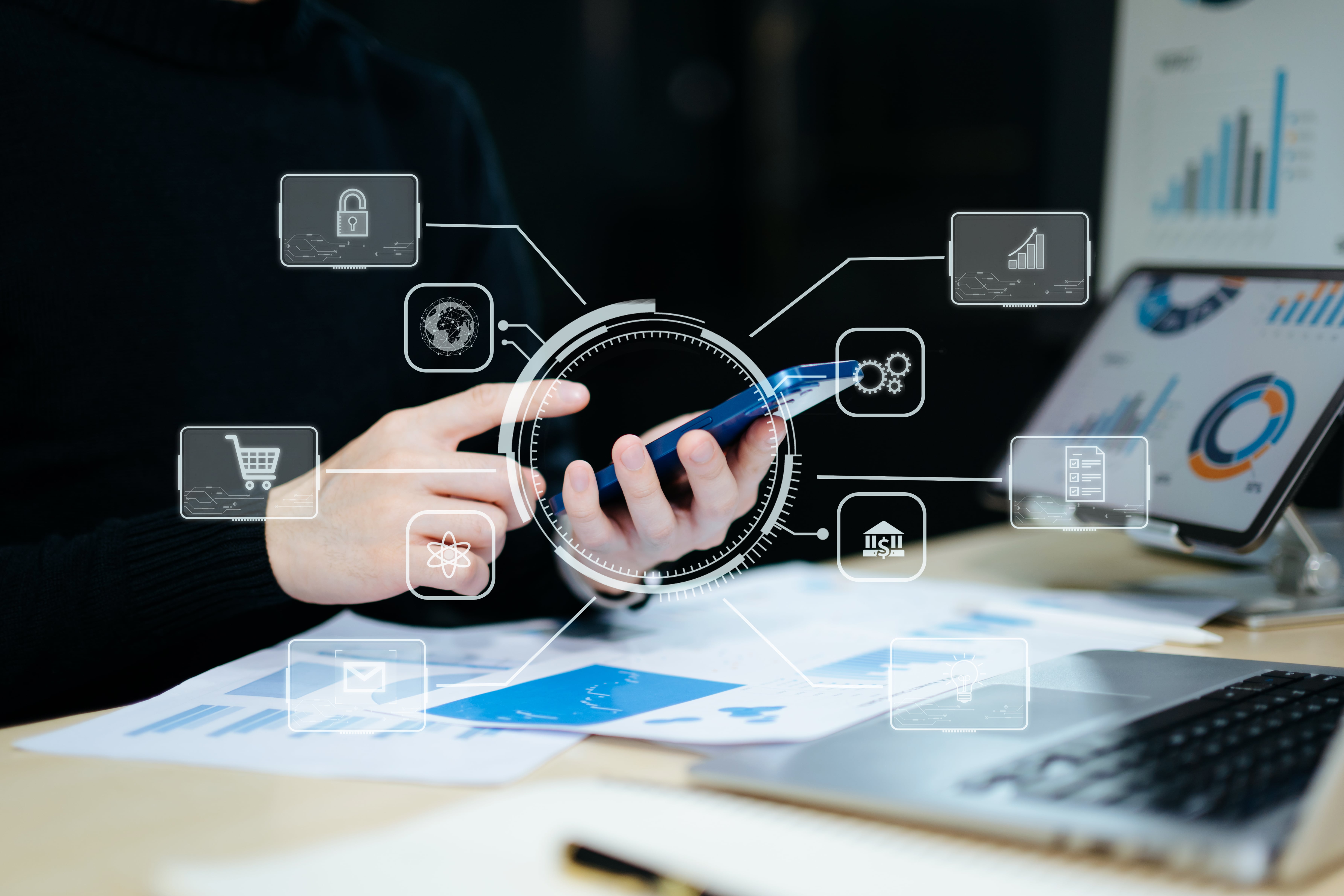 Business professional using smartphone for digital marketing with virtual interface icons and data analytics dashboard