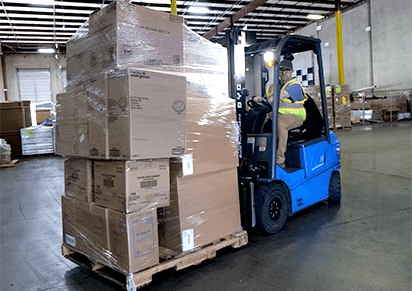 Prism Logistics warehouse team group photo