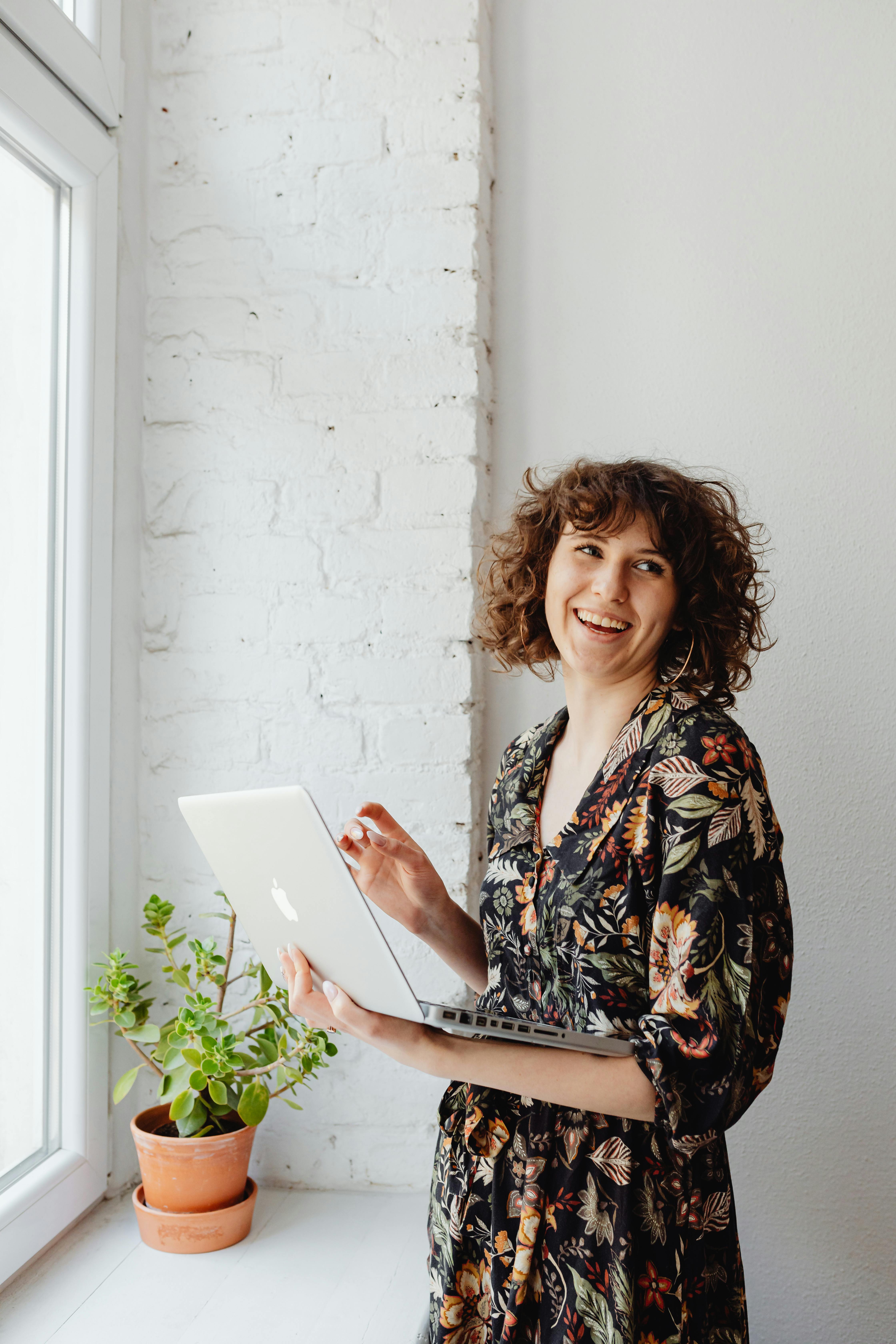 person sitting on couch holding a Surface device