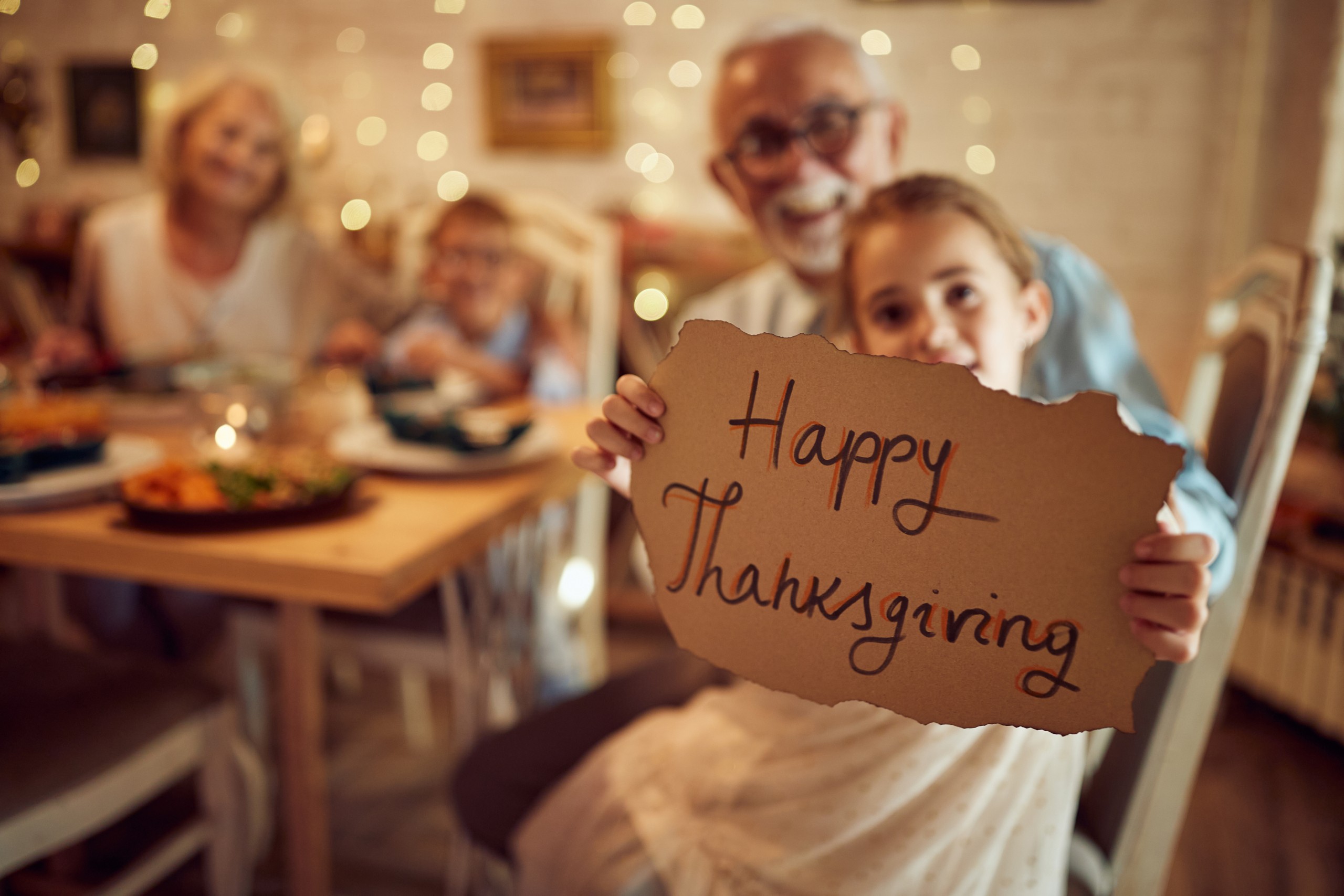 Preschool children at Blooming Buds in Syosset participating in a Thanksgiving gratitude activity in a warm early childhood classroom.
