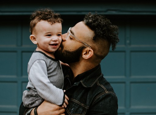 dad kissing son