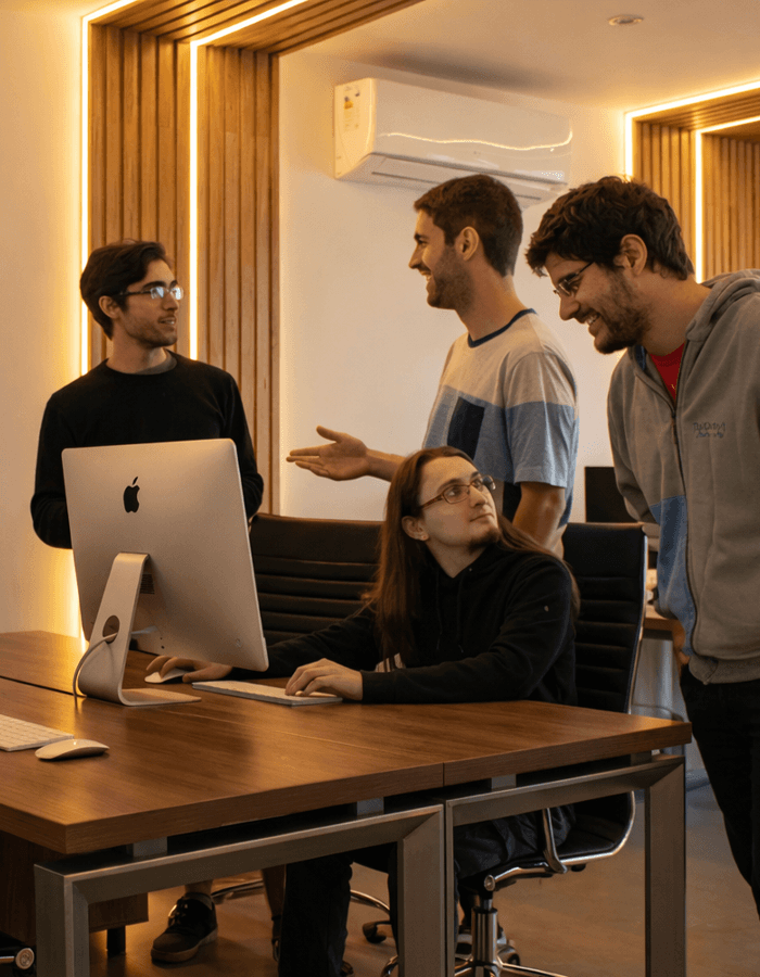 A man carrying a large tan leather tote bag with a pyramid in the background.