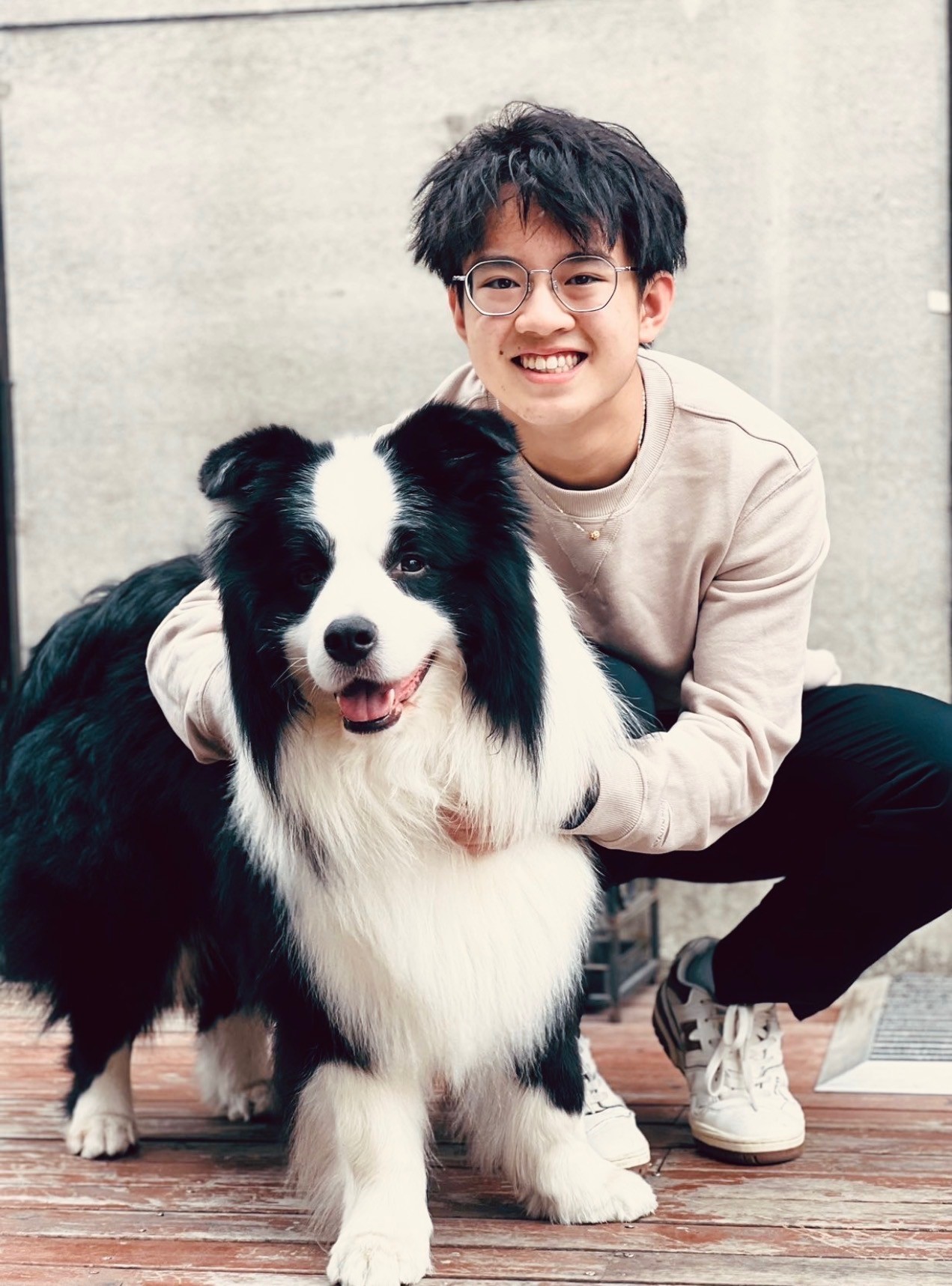 the founder with a black and white dog